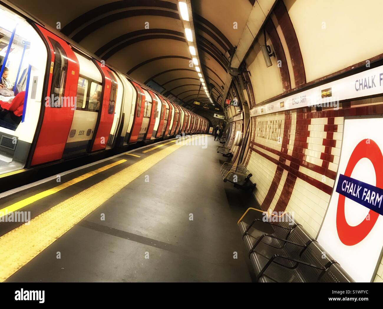 A train with doors open awaiting departure at the platform of Chalk Farm underground station, London - Smartphone Captured Stock Image
