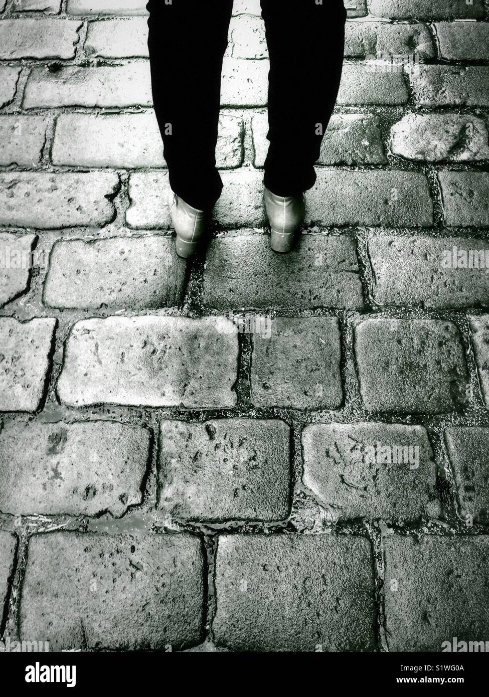 Woman in black boots walking hi-res stock photography and images - Alamy