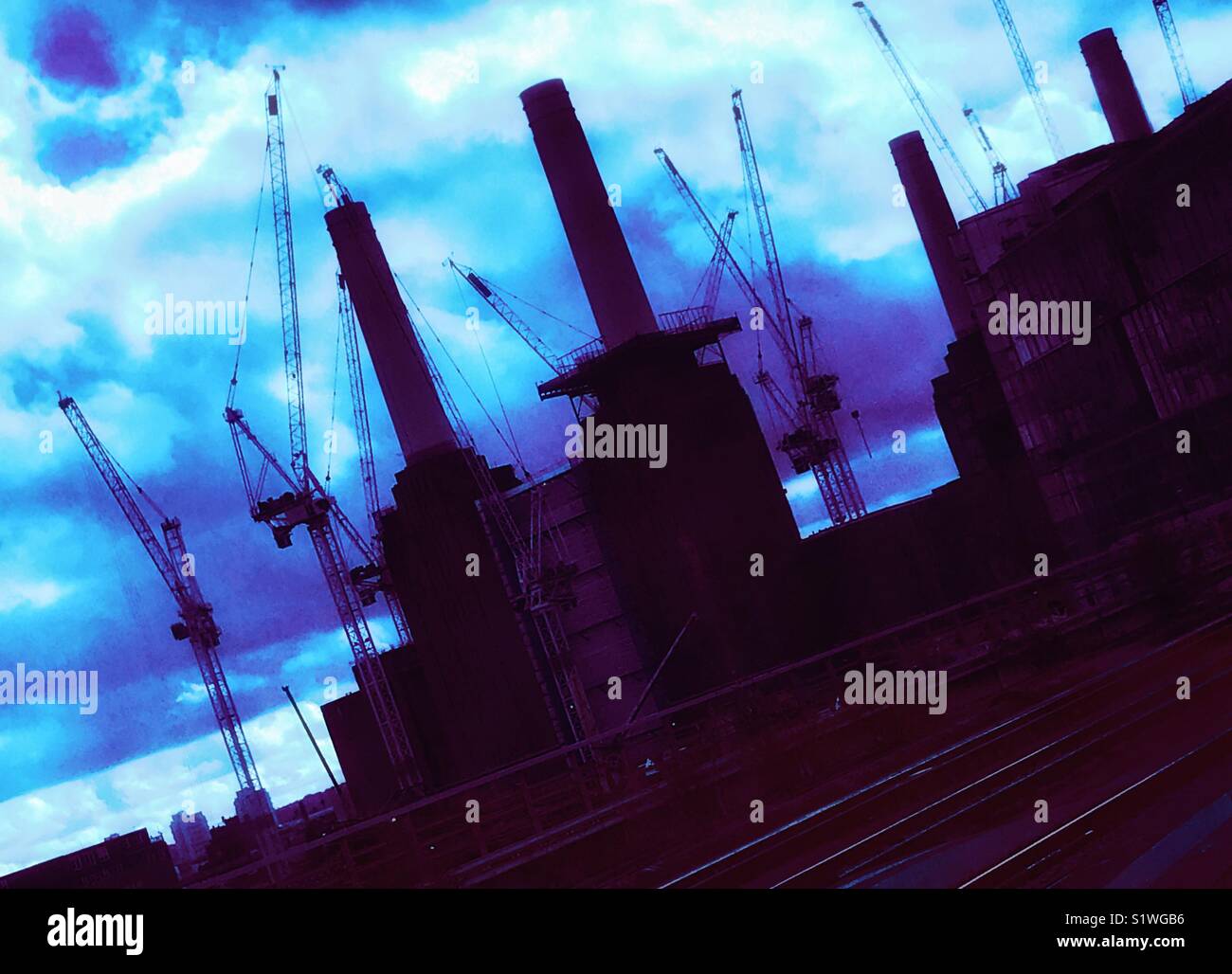 A sea of cranes surround London’s iconic Battersea Power Station, currently being refurbished and redeveloped by Carillion - Smartphone Captured Stock Image