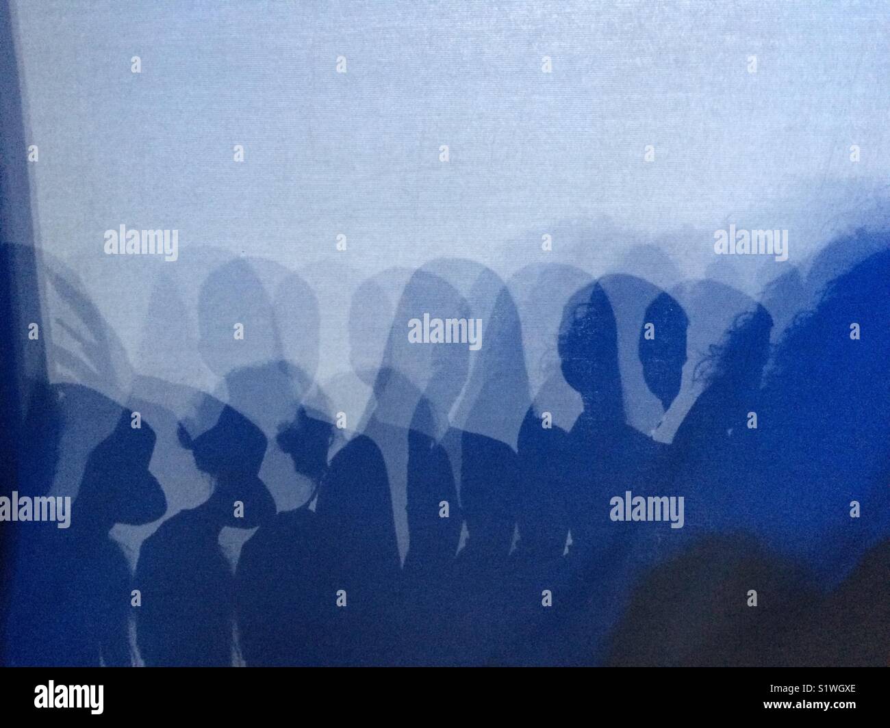 Shadows of performers on back cyc on  stage. - Smartphone Captured Stock Image