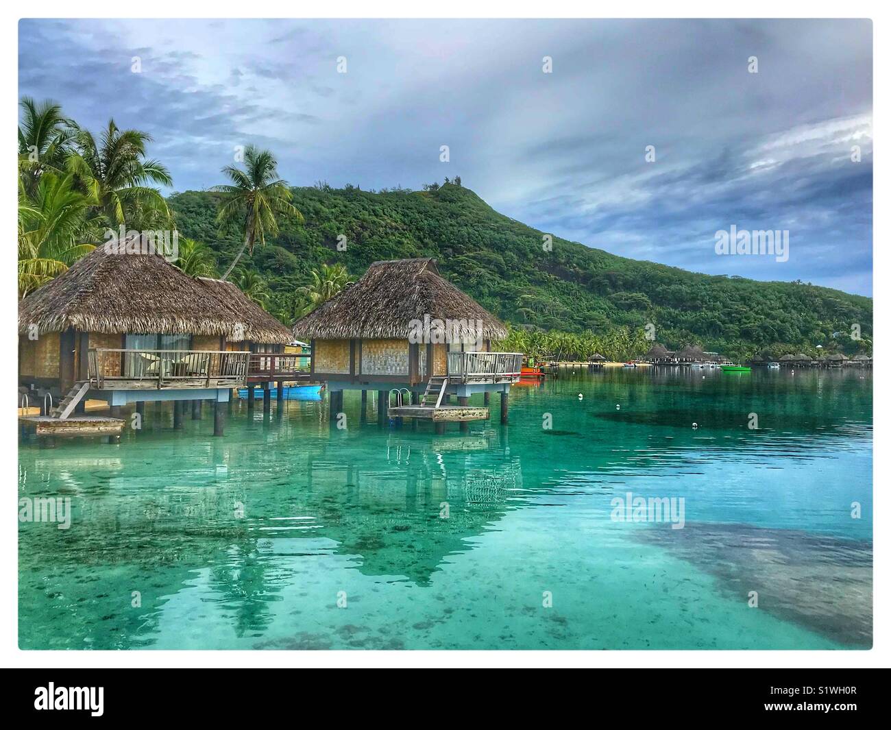 Beautiful picture of the over the water bungalows on the island of Bora-Bora in French Polynesia - Smartphone Captured Stock Image
