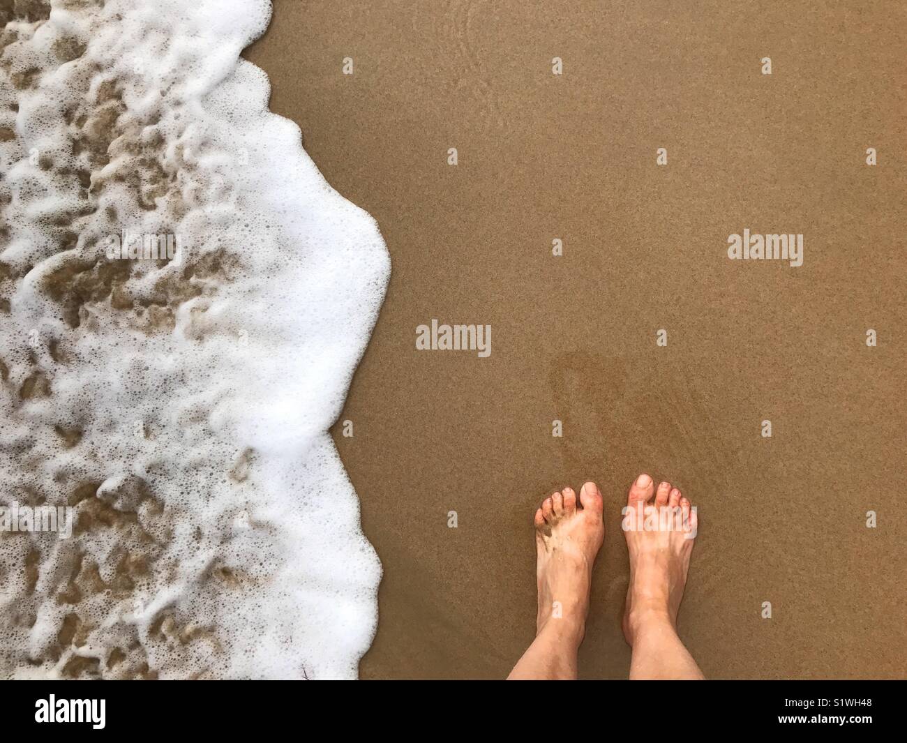 Woman's feet at the sea shore. - Smartphone Captured Stock Image