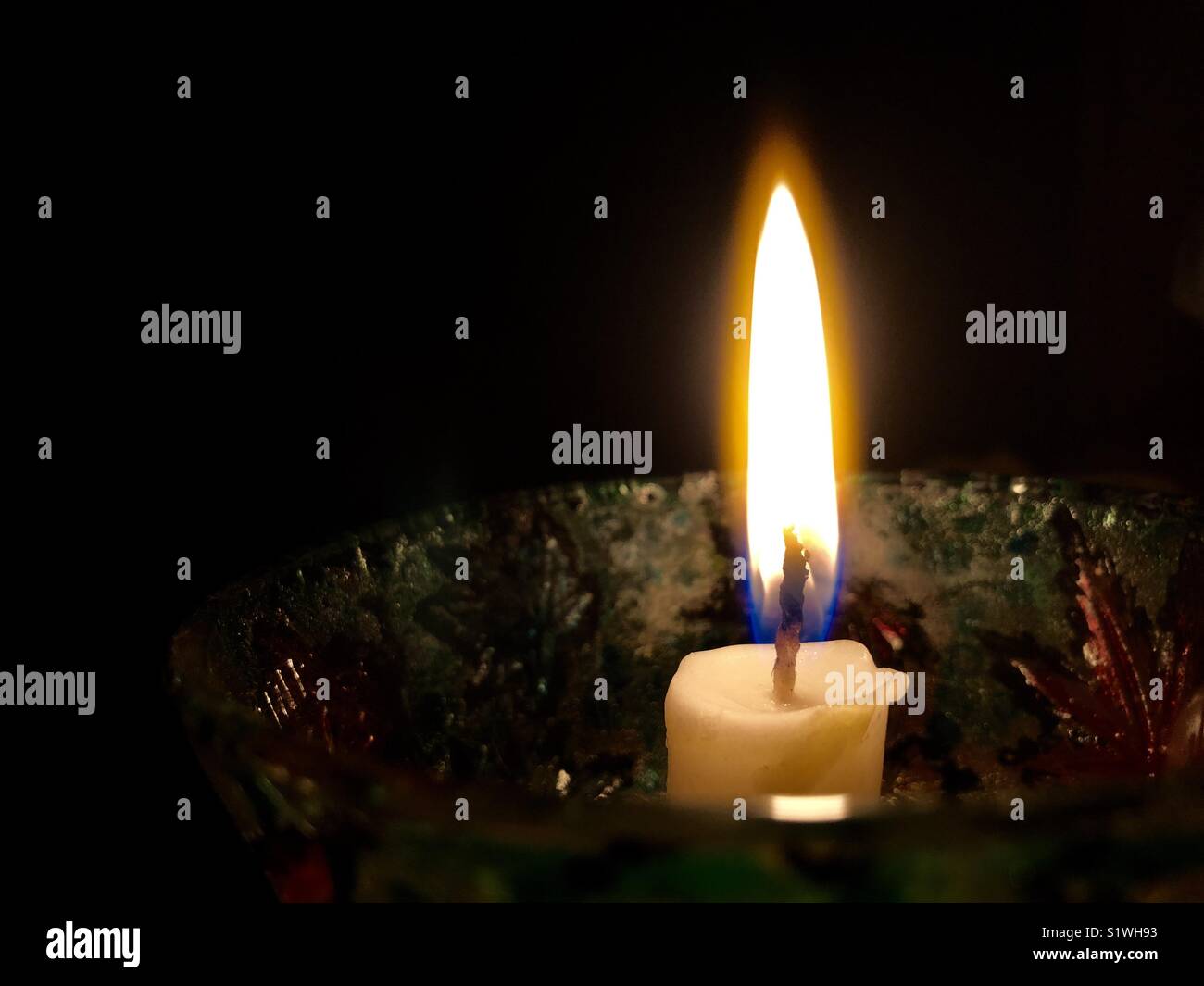 The burning candle in the night Stock Photo Alamy