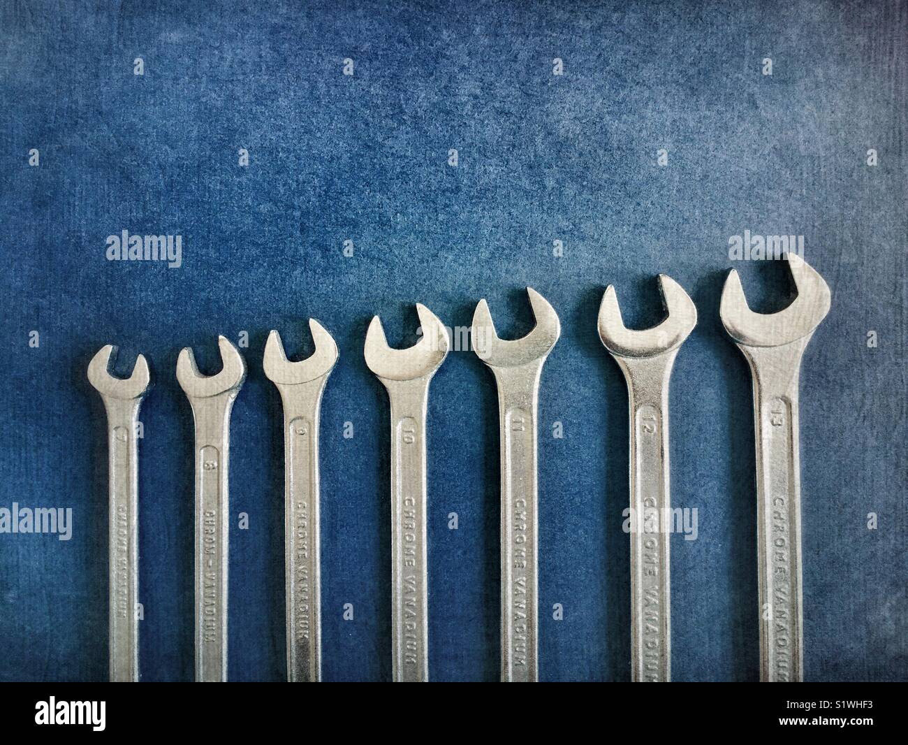 Set of metal wrenches on a blue background - Smartphone Captured Stock Image