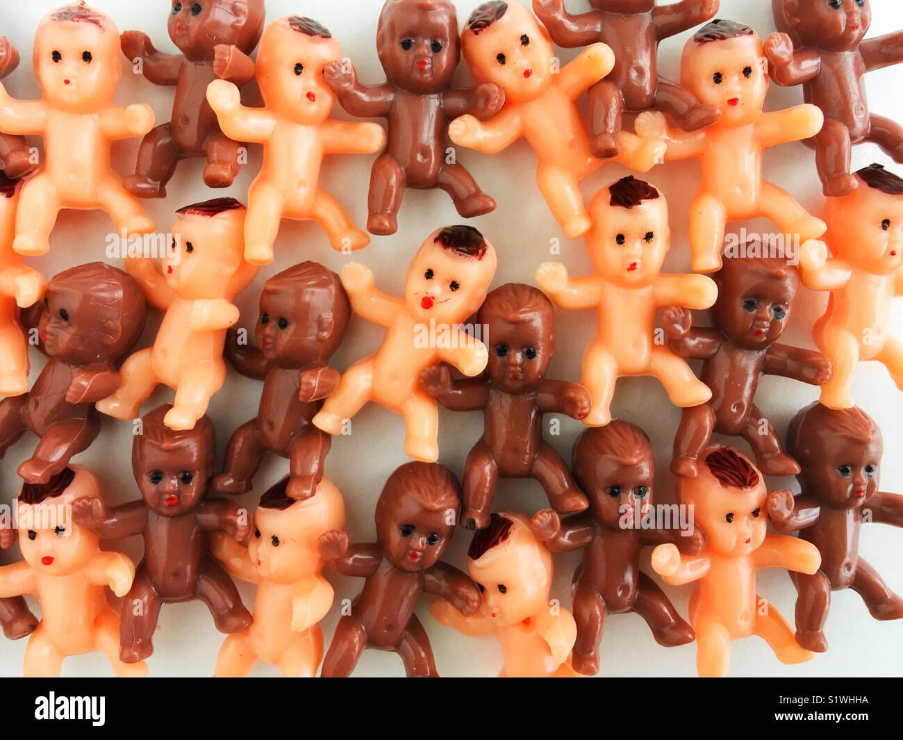 A pile of tiny toy babies. Stock Photo