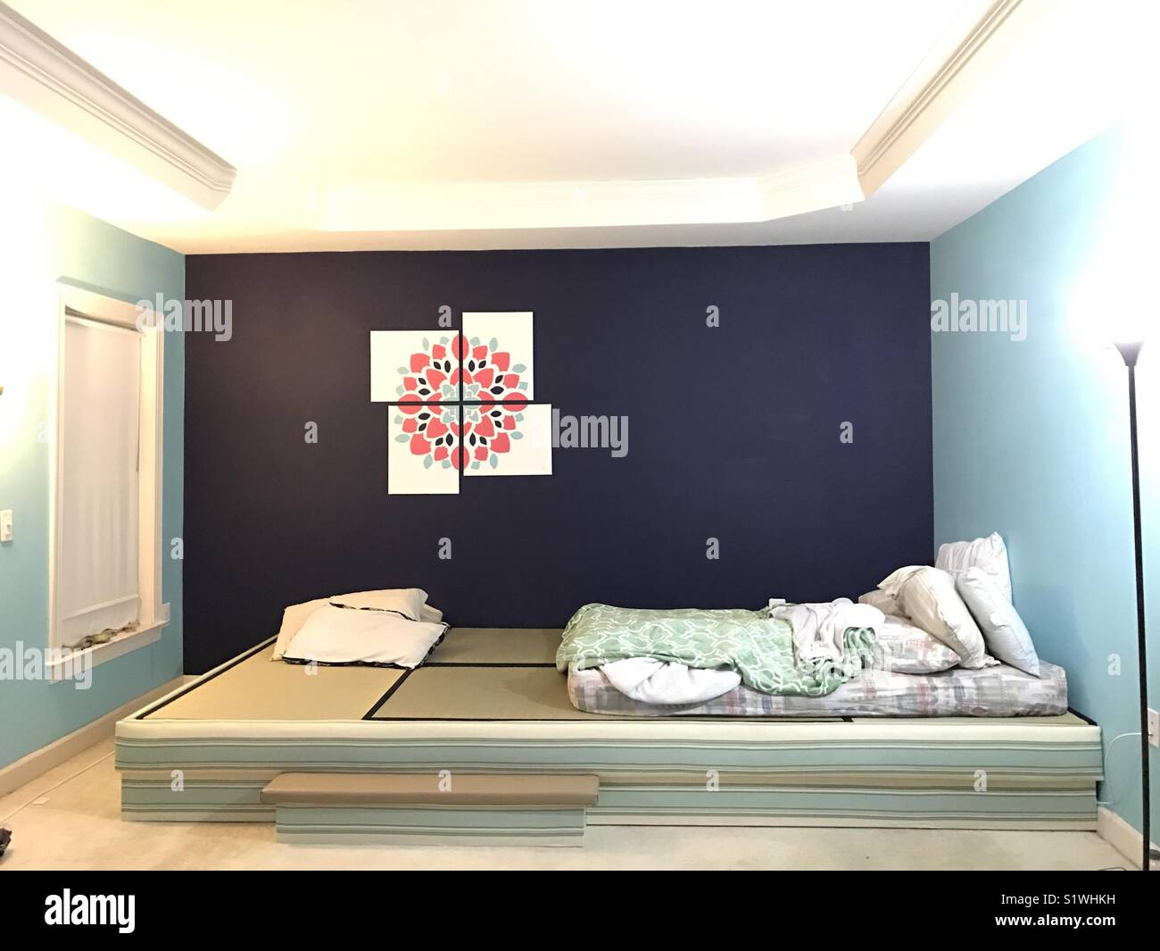 Making a new home... my first DIY multi-canvas painting, tatami platform  bed... my zen place Stock Photo - Alamy