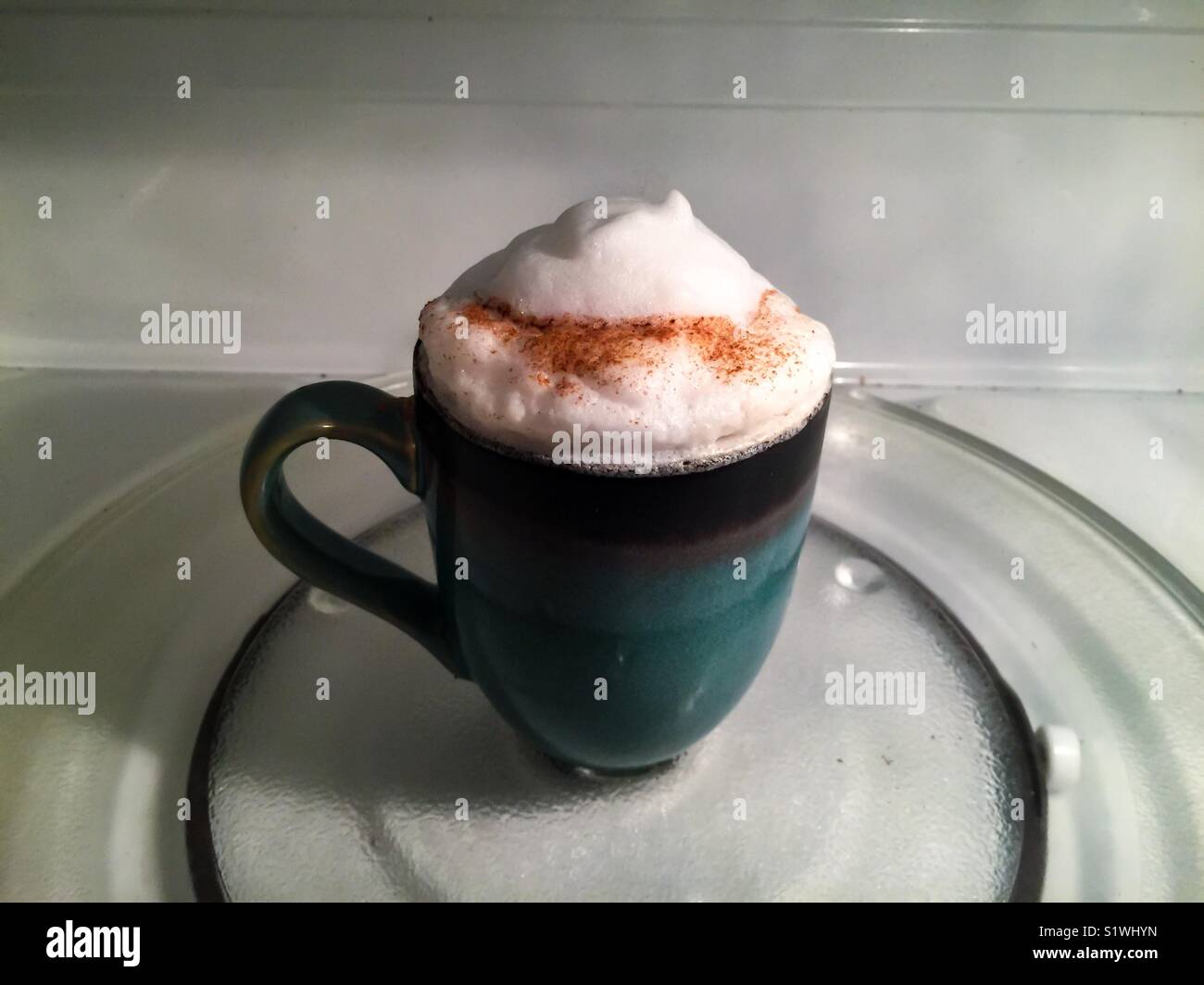 A Perfect cappuccino. Overflowing with foam. Yum. Yummy. Room for text. Top notch. Stock Photo