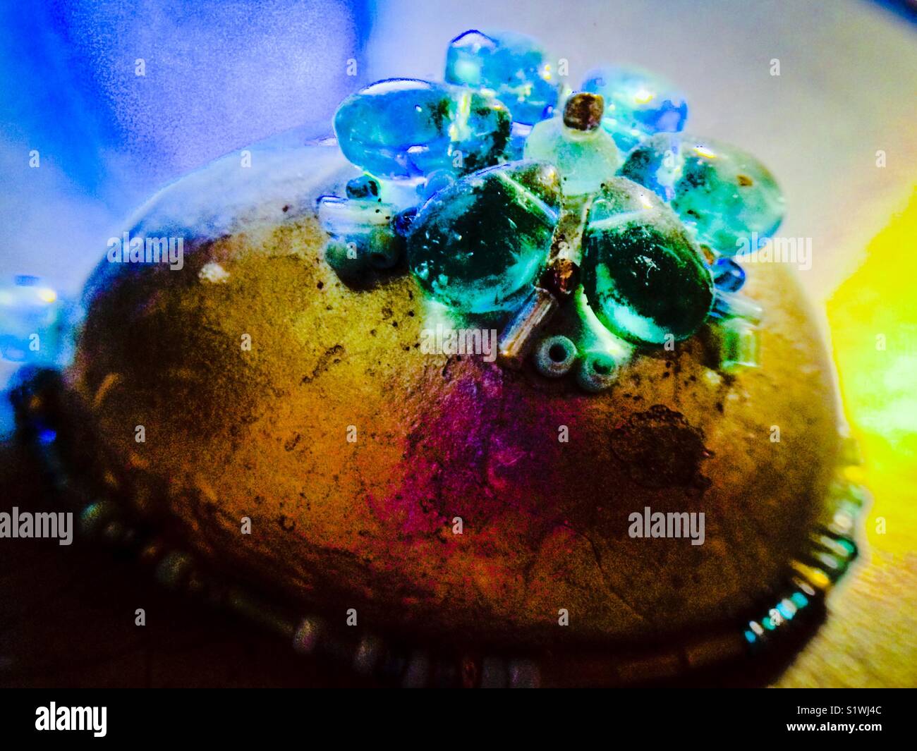 Silver painted eggshell decorated with aqua beads - Smartphone Captured Stock Image