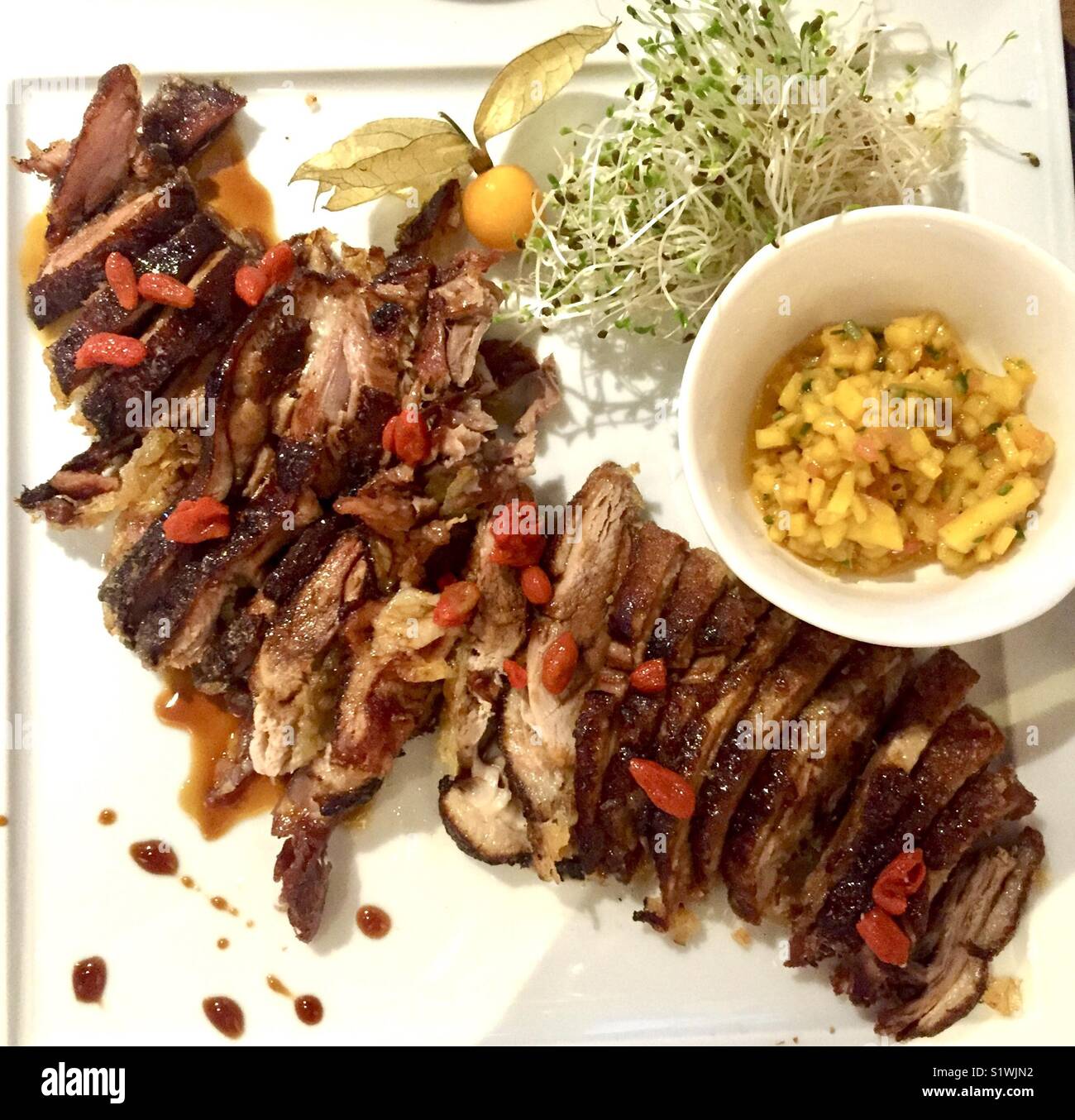 Crispy duck with mango chinese style Stock Photo Alamy