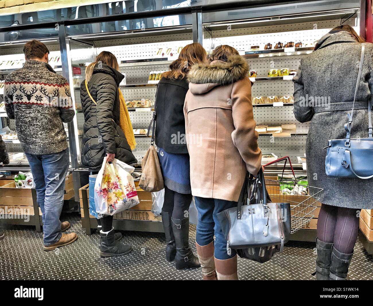 People choosing sandwiches from the chilled section of a Pret A Manger food outlet in Somerset, England. - Smartphone Captured Stock Image