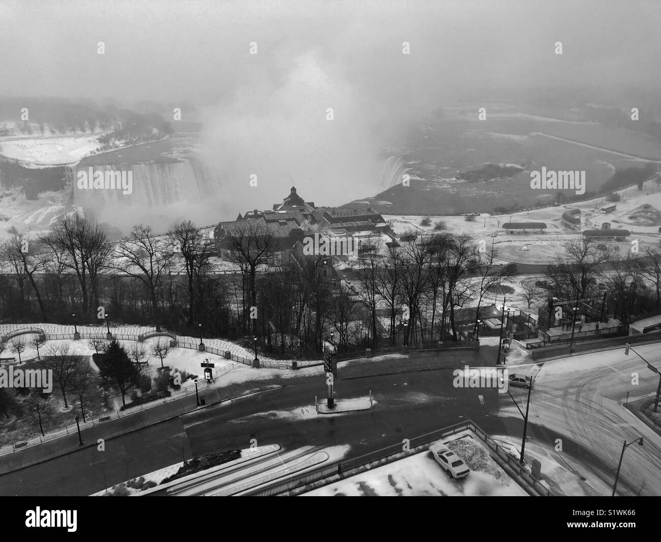 Black and white aerial view of the Horseshoe Falls in Niagara Falls, Ontario in the winter. - Smartphone Captured Stock Image