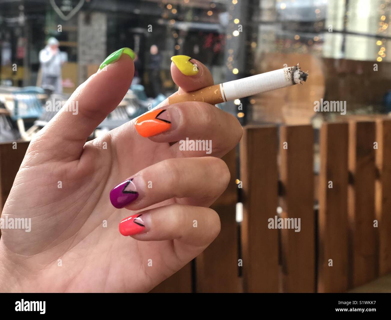 Woman smoking cigarette - Smartphone Captured Stock Image