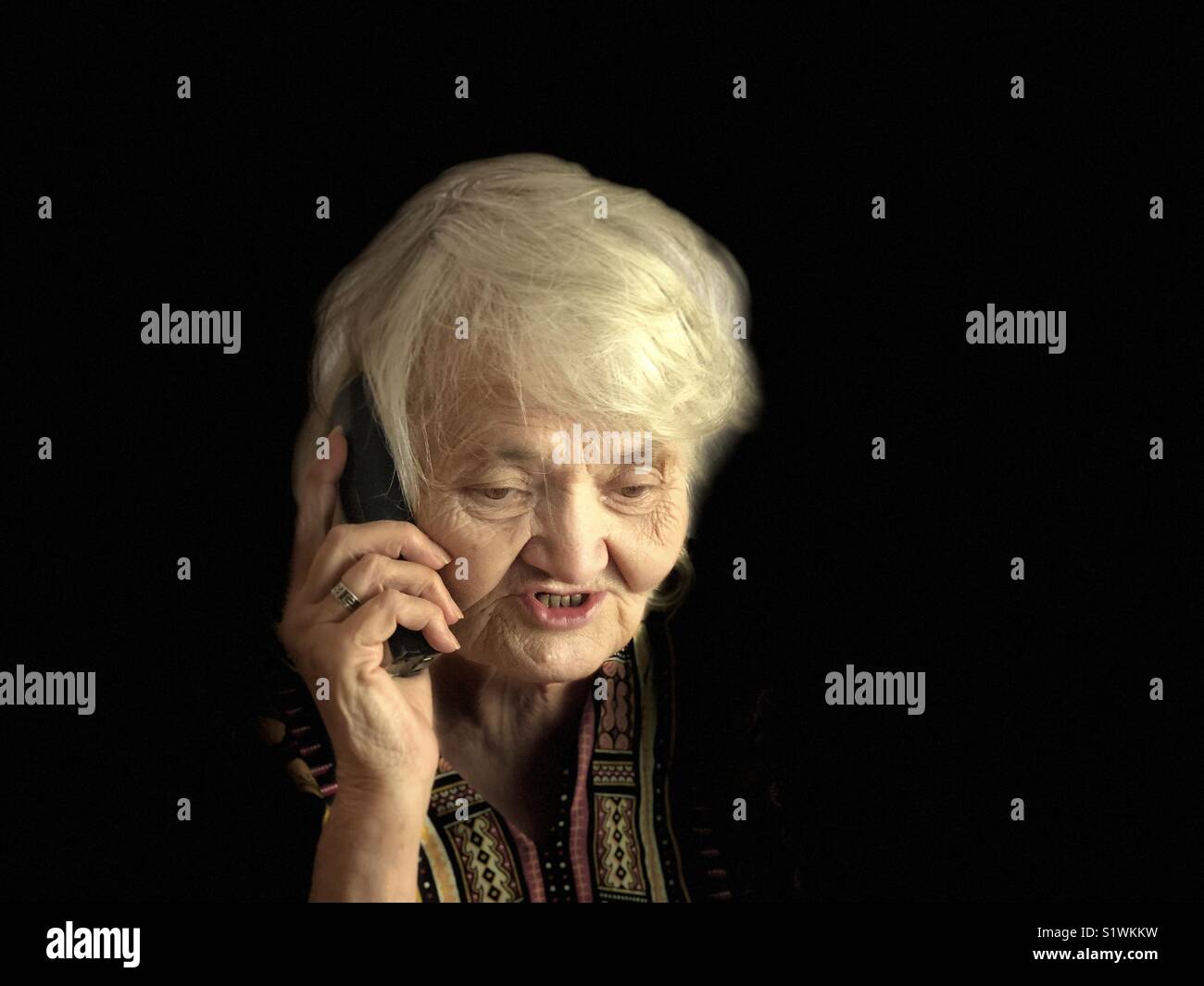 Senior woman talking on the phone Stock Photo - Alamy