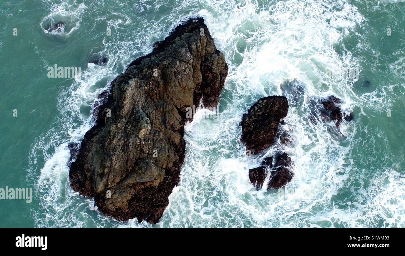 Rocks in the beach Stock Photo - Alamy