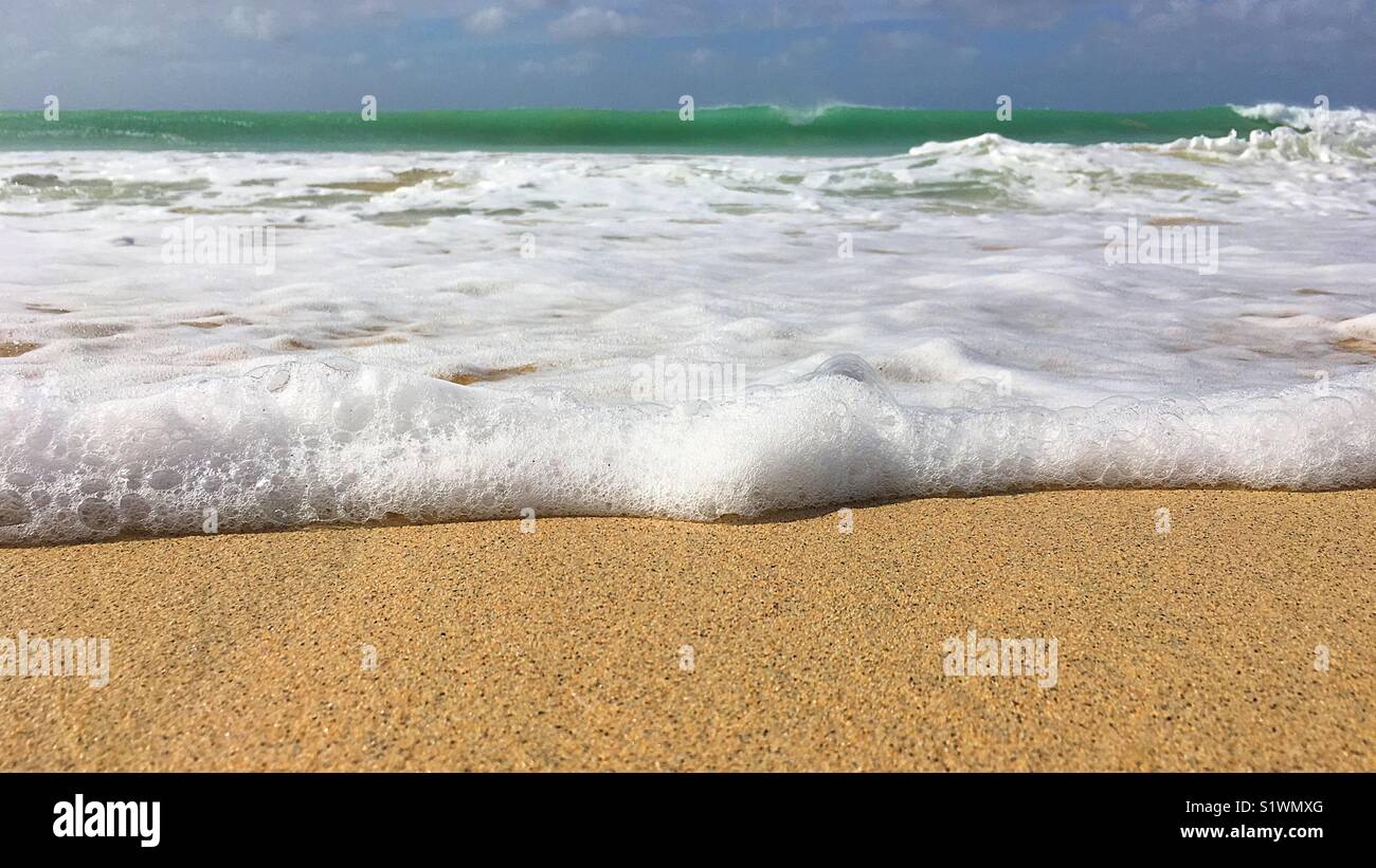 Incoming tide on sand beach - Smartphone Captured Stock Image