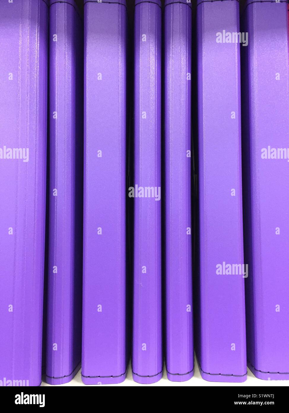 A row of purple books Stock Photo