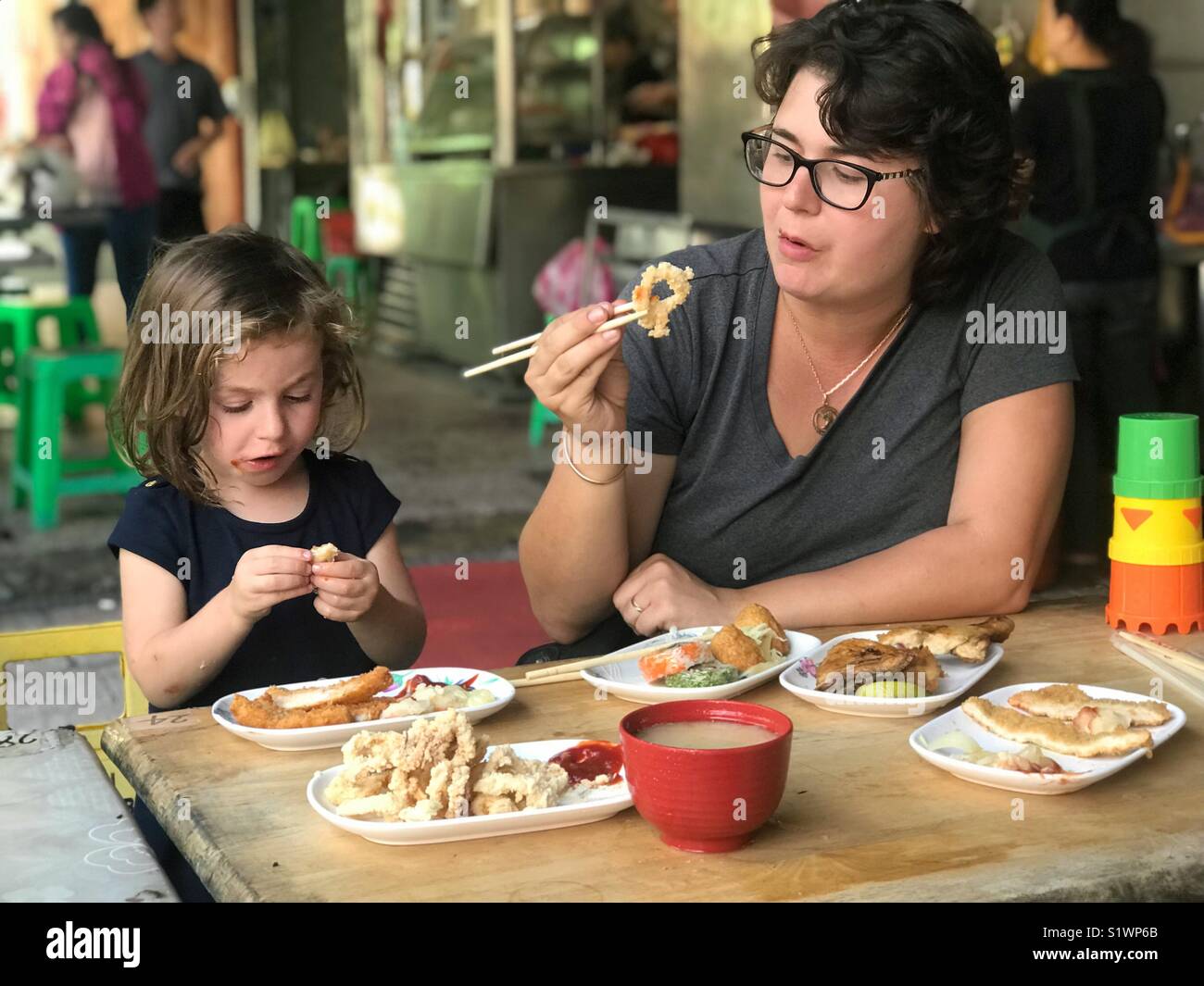 Mother and daughter eating chinese food Tainan Taiwan - Smartphone Captured Stock Image