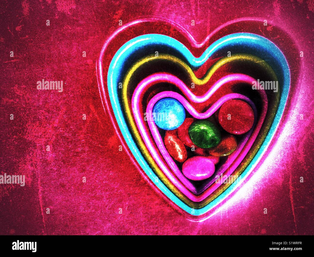 Colourful hearts with candy Stock Photo