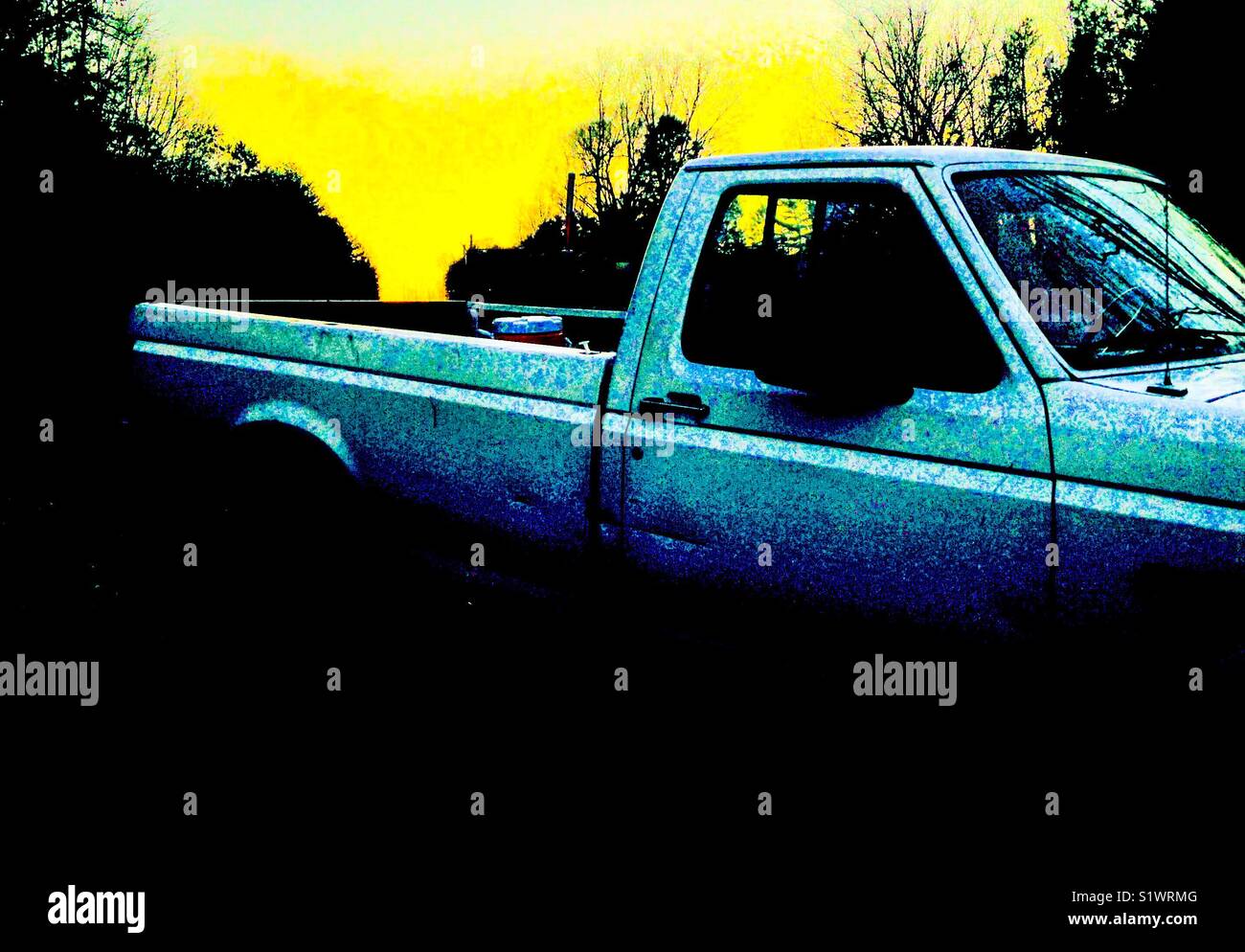 White pickup frames January sunset on the pipeline Stock Photo Alamy