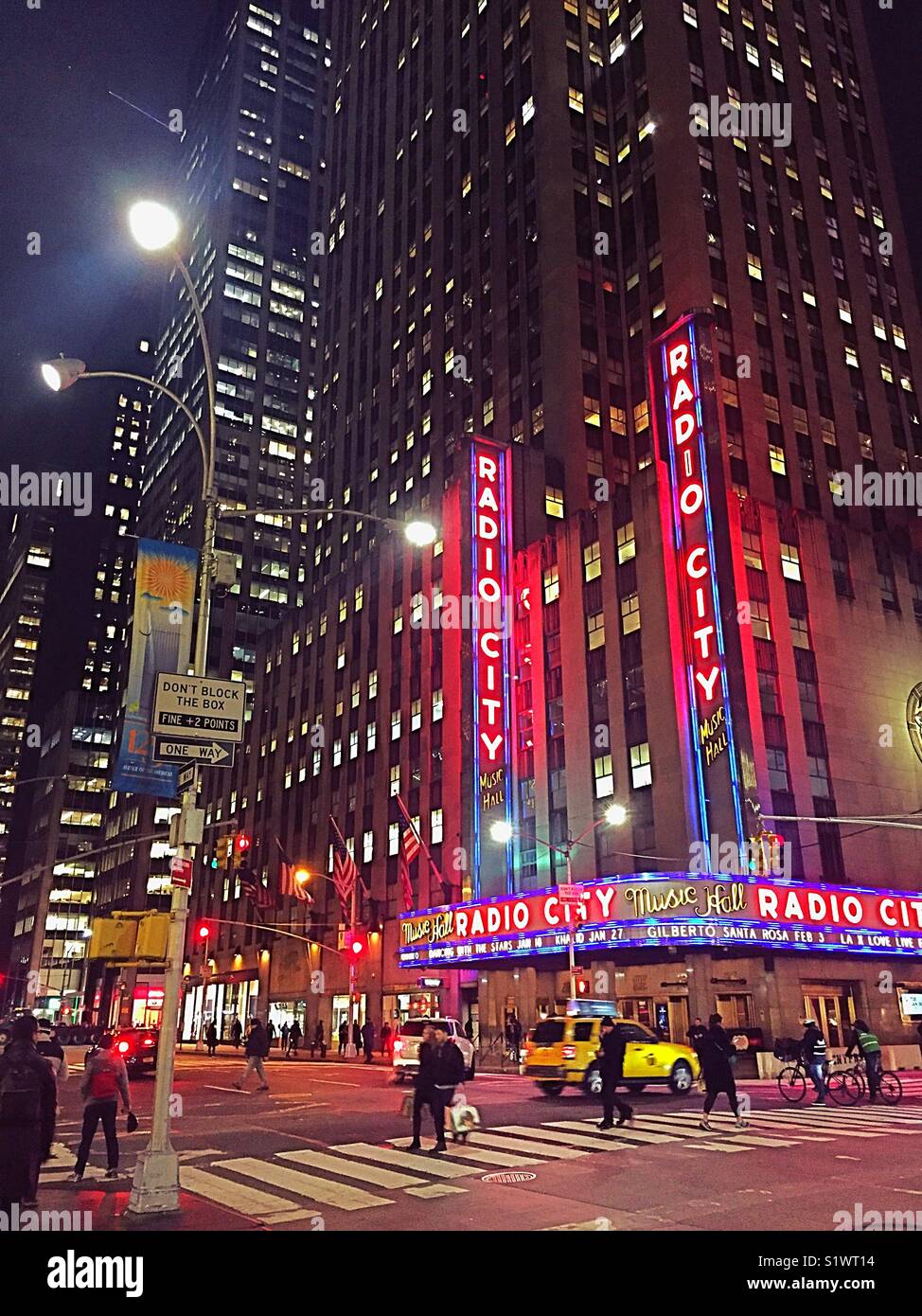 Radio city music hall in Rockefeller Center along Avenue of the Americas at dusk, New York City, USA - Smartphone Captured Stock Image