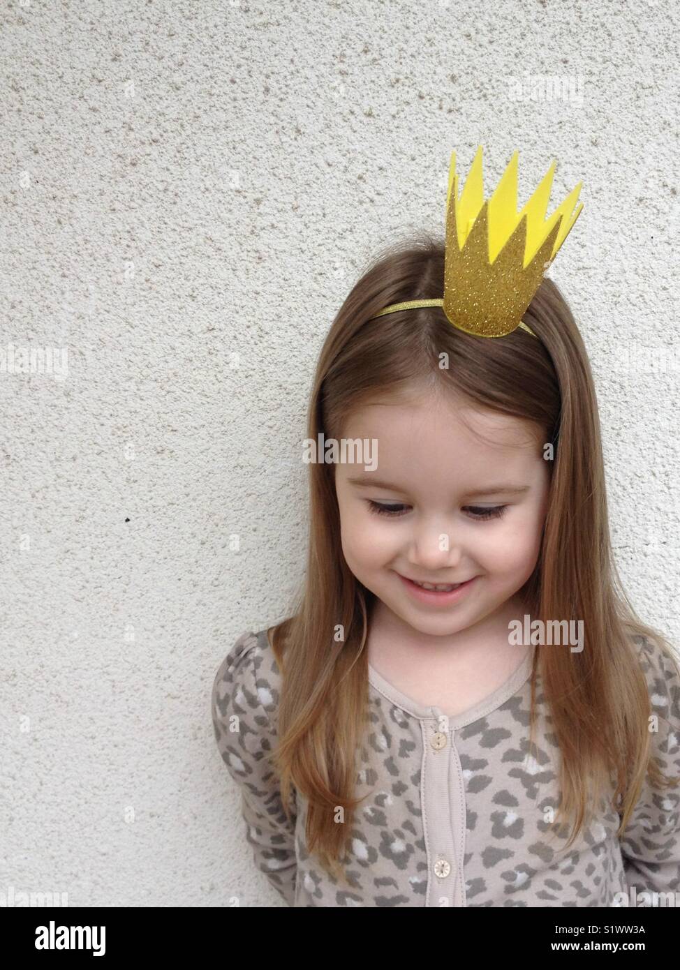 Little girl wearing glitter crown headband Stock Photo Alamy