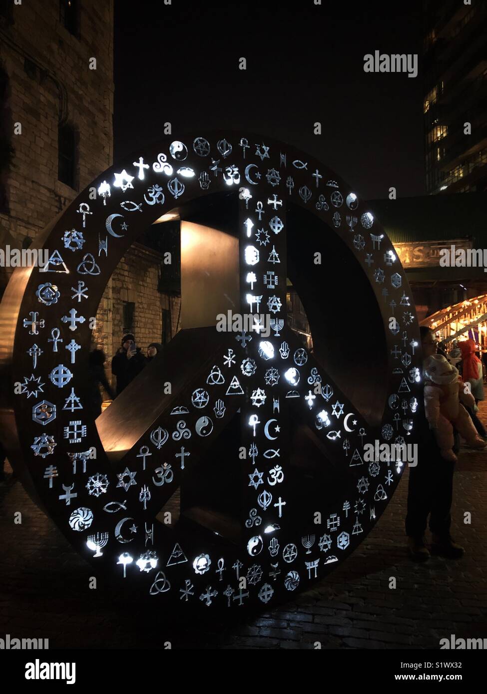 A black and white sculpture, Symbolic Peace, at Toronto’s Light Festival. - Smartphone Captured Stock Image