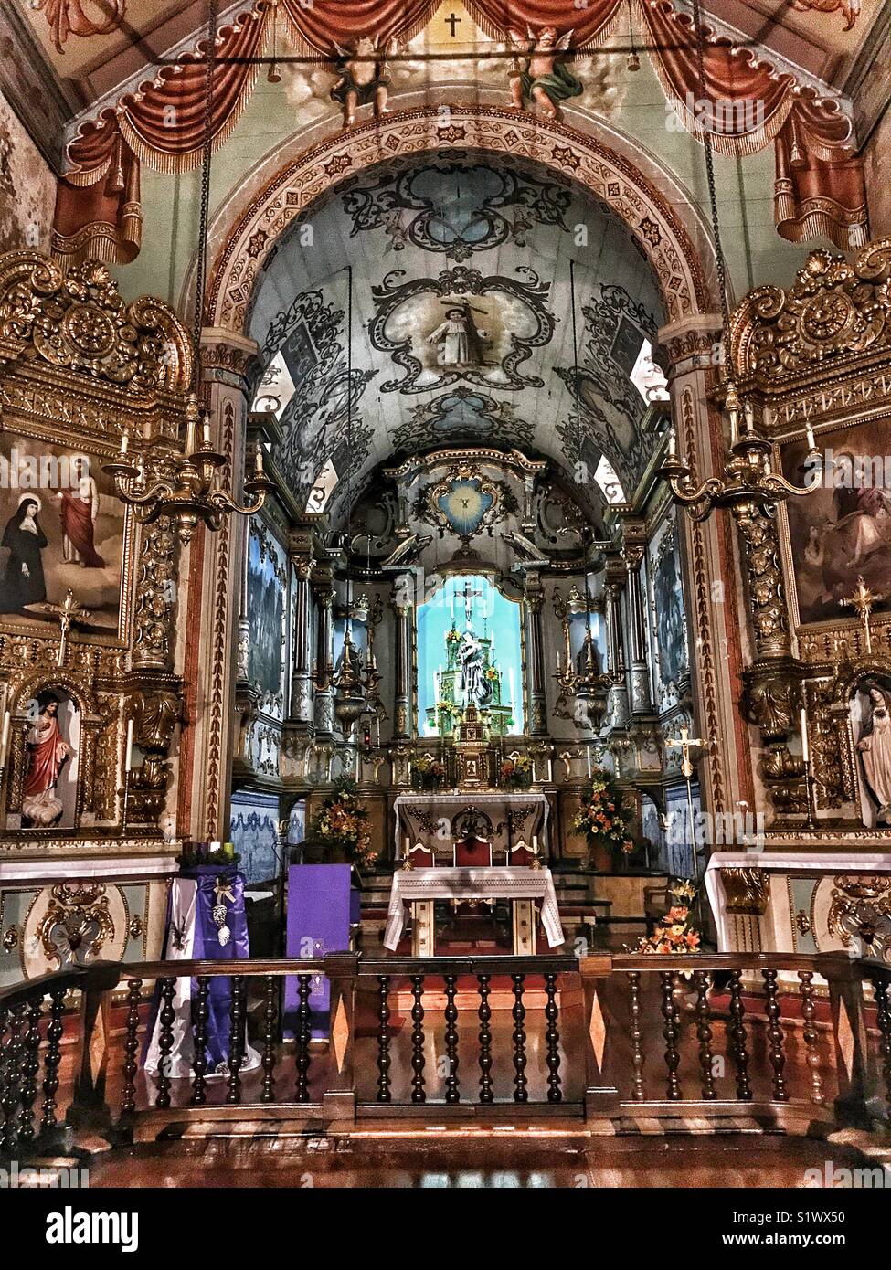 The magnificent, ornate interior and painted ceiling of São Vicente parish church, São Vicente, Madeira, Portugal - Smartphone Captured Stock Image