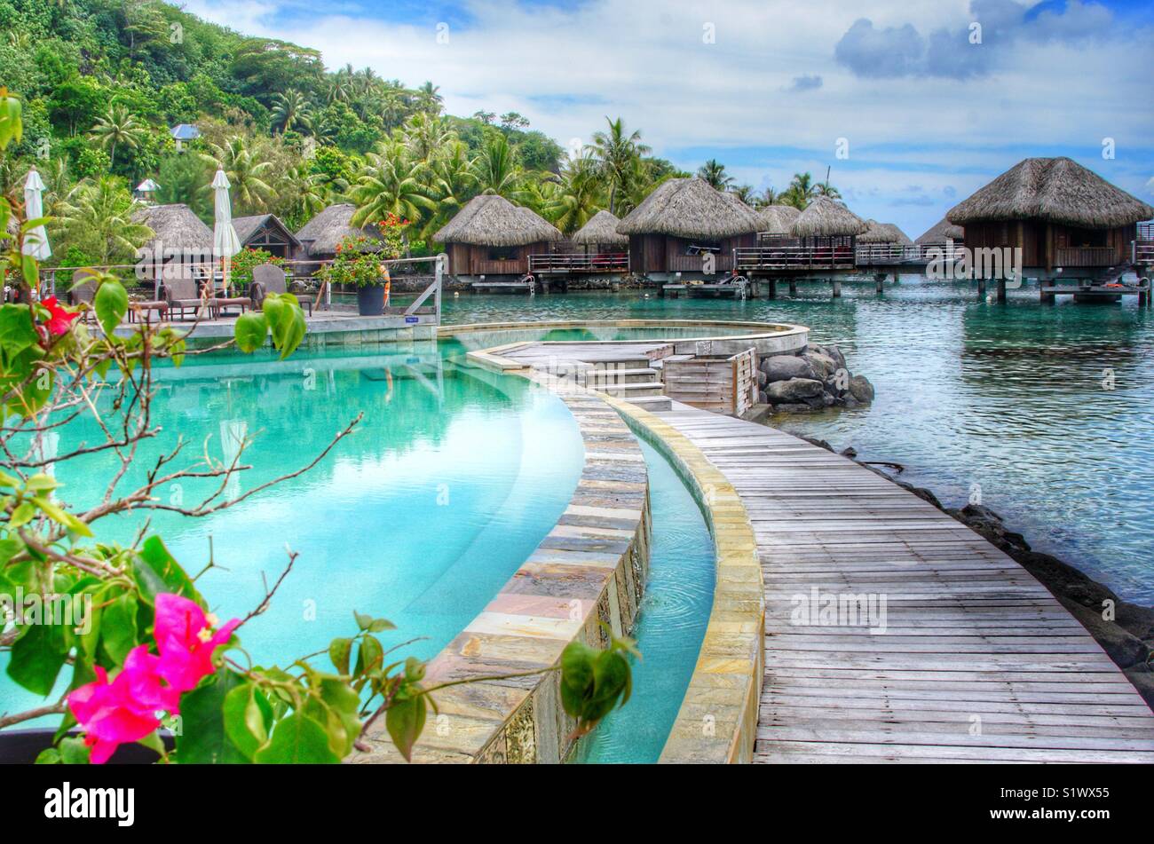 Resort with over the water bungalows and infinity pool on the island of Bora-Bora in French Polynesia in the South Pacific - Smartphone Captured Stock Image