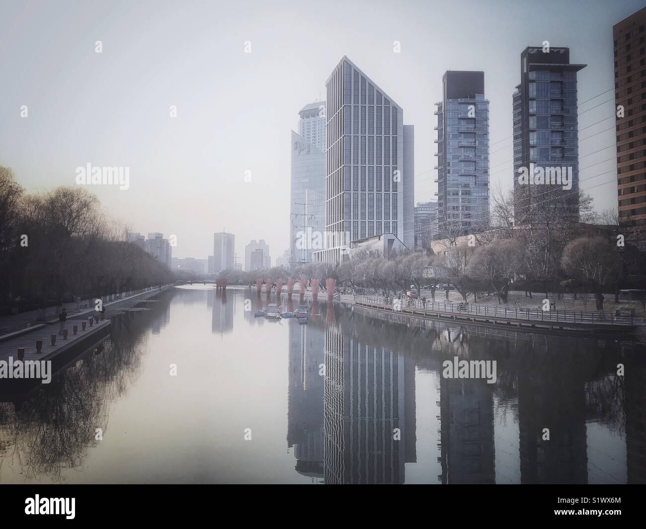 Skyscrapers and their reflections in the canal. Beijing, China. - Smartphone Captured Stock Image