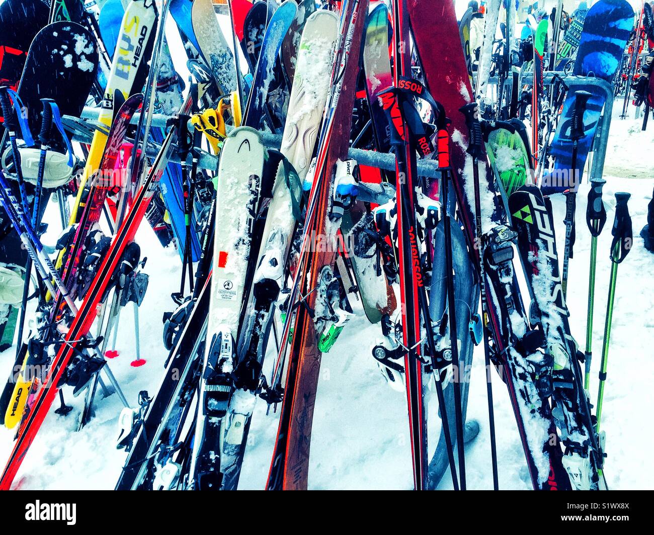 Downhill skis piled up Stock Photo