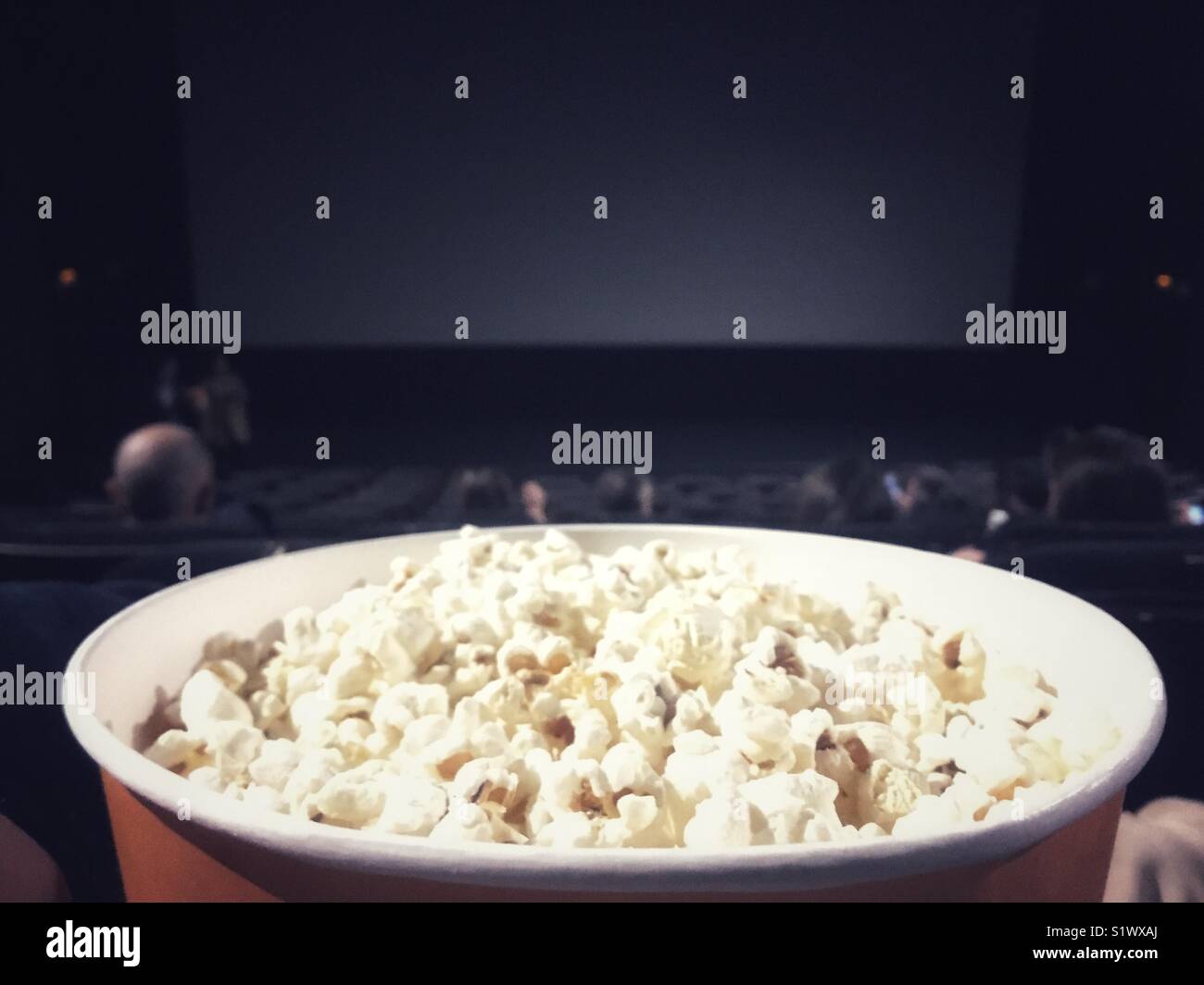 Popcorn bowl at the movie theather Stock Photo