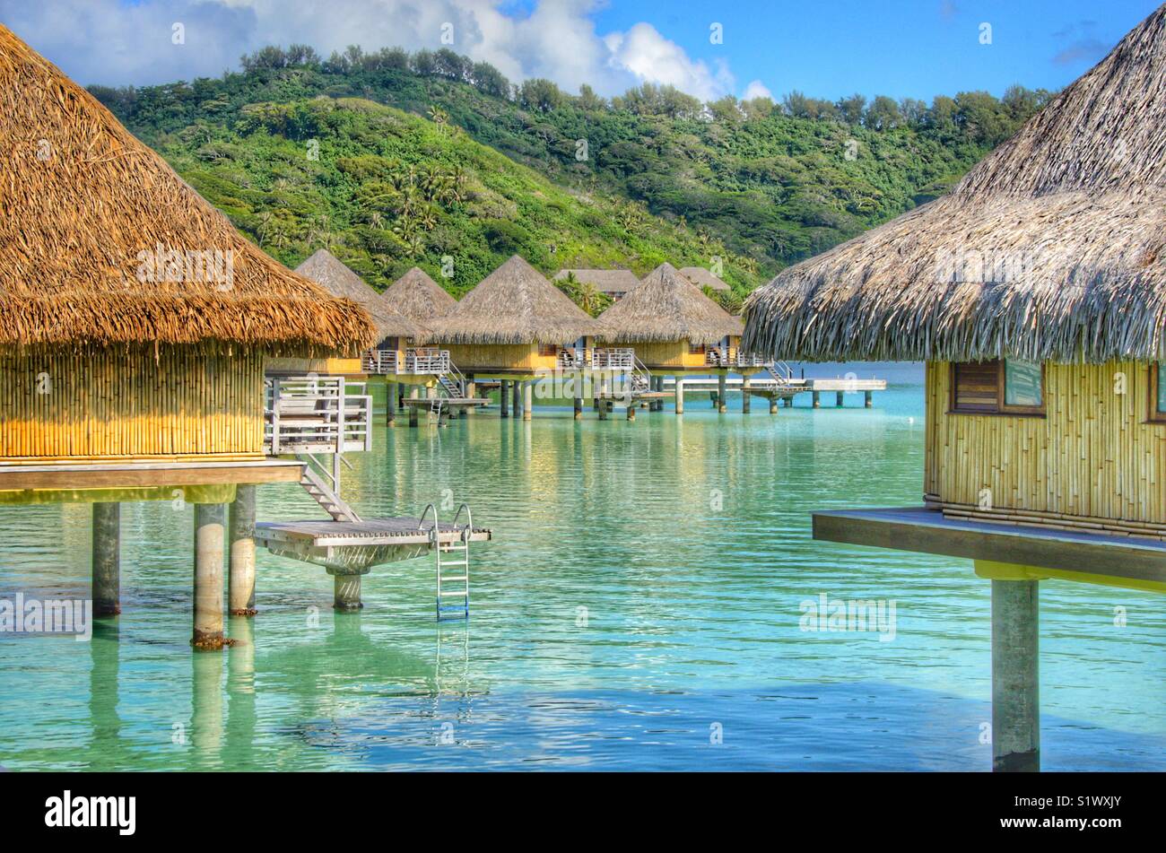 Over the water bungalow on the island to Bora-Bora, French  Polynesia in the South Pacific - Smartphone Captured Stock Image