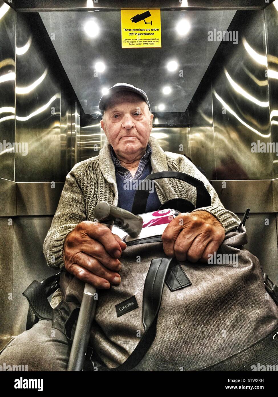 Patient leaving hospital by lift - Smartphone Captured Stock Image