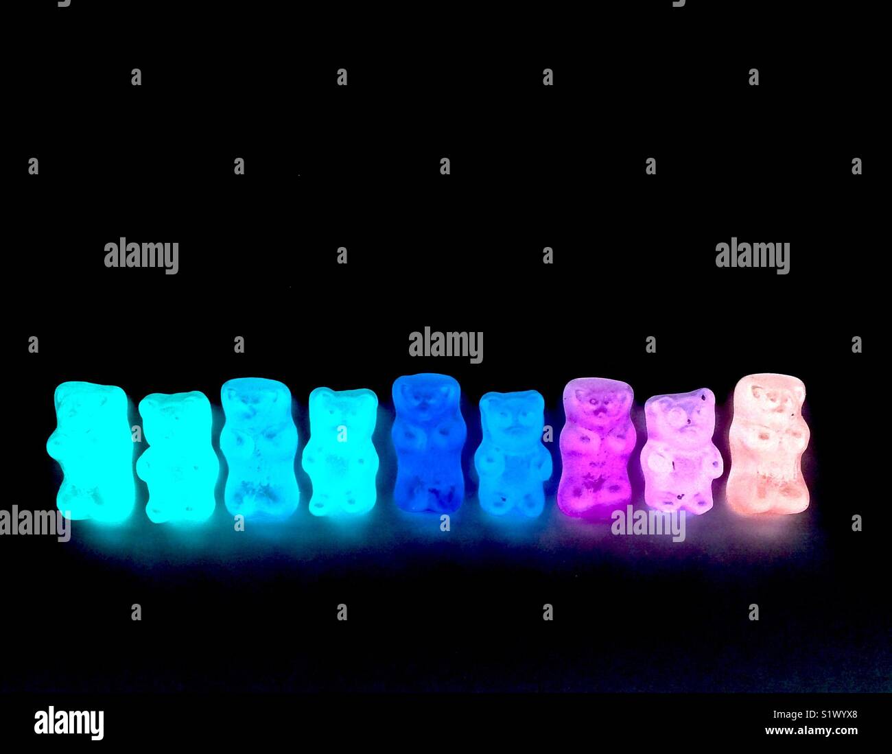 Gummy bears candy glowing in the dark Stock Photo