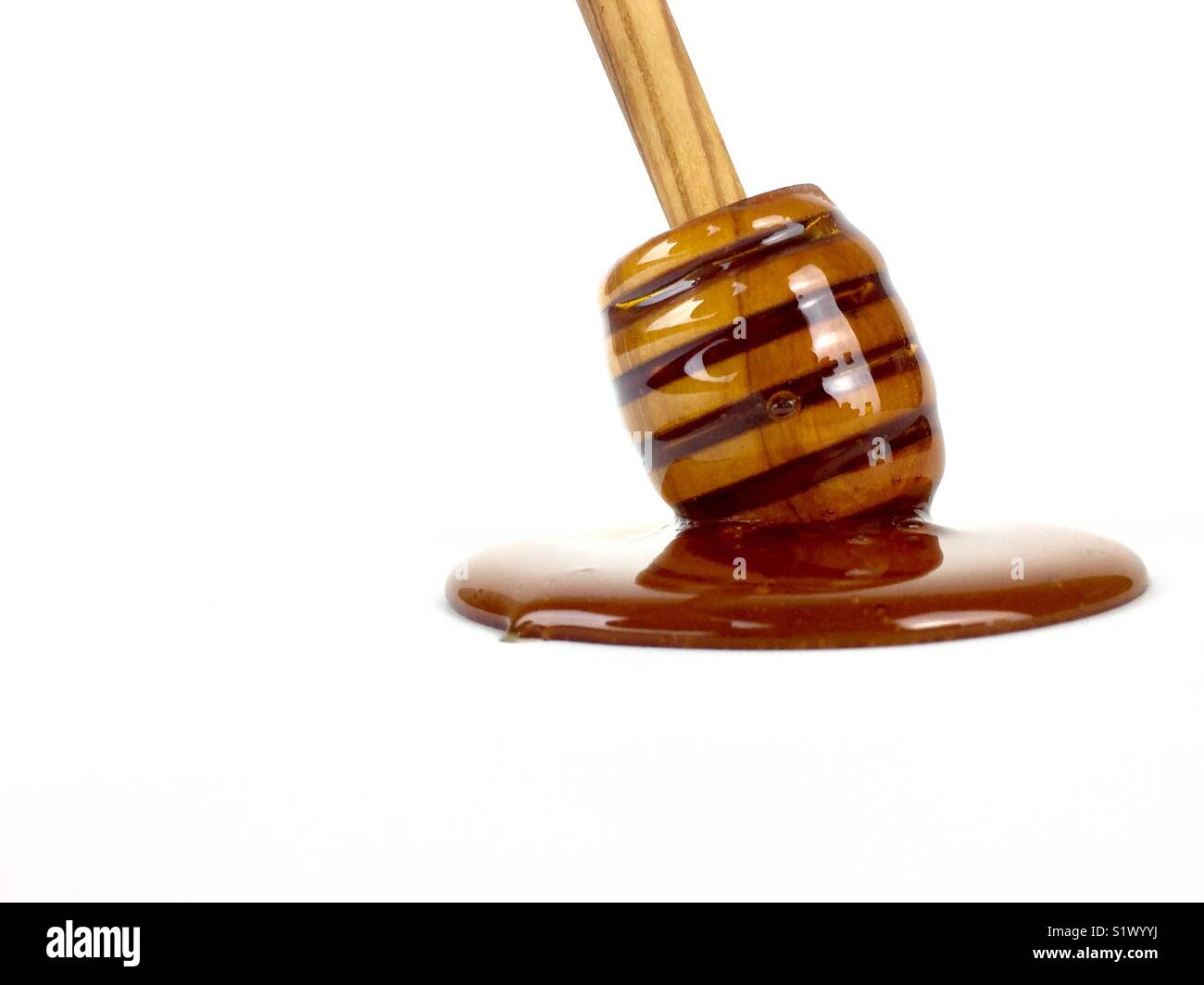 Honey dipper on a white background - Smartphone Captured Stock Image
