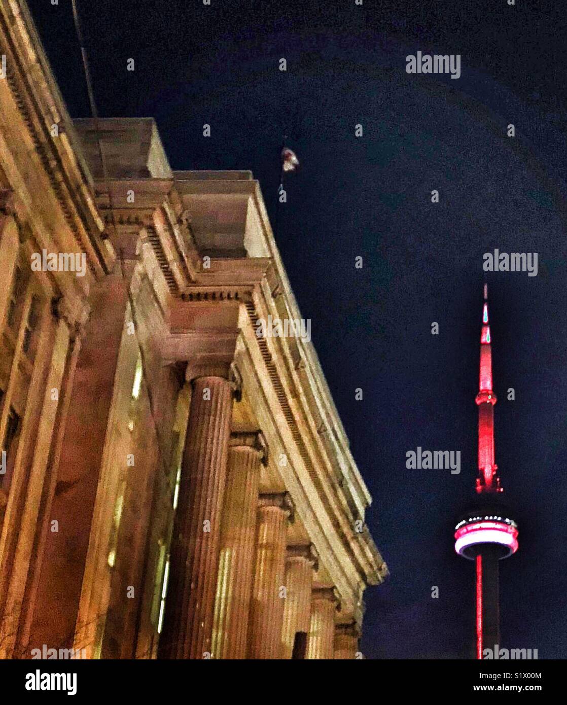 A red and white illuminated CN Tower in Toronto Stock Photo - Alamy