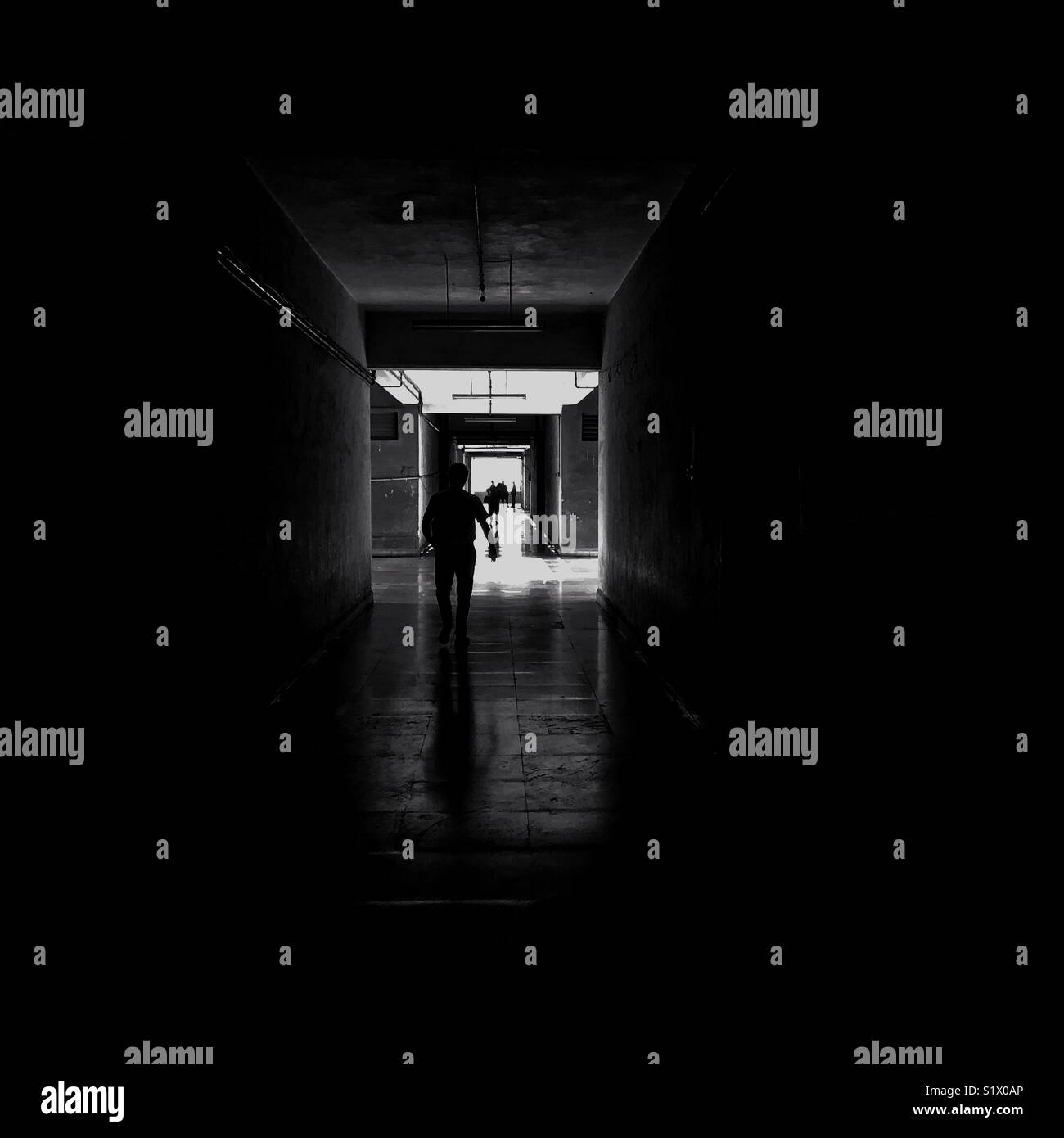 A man walks at Antop hill warehousing complex. - Smartphone Captured Stock Image