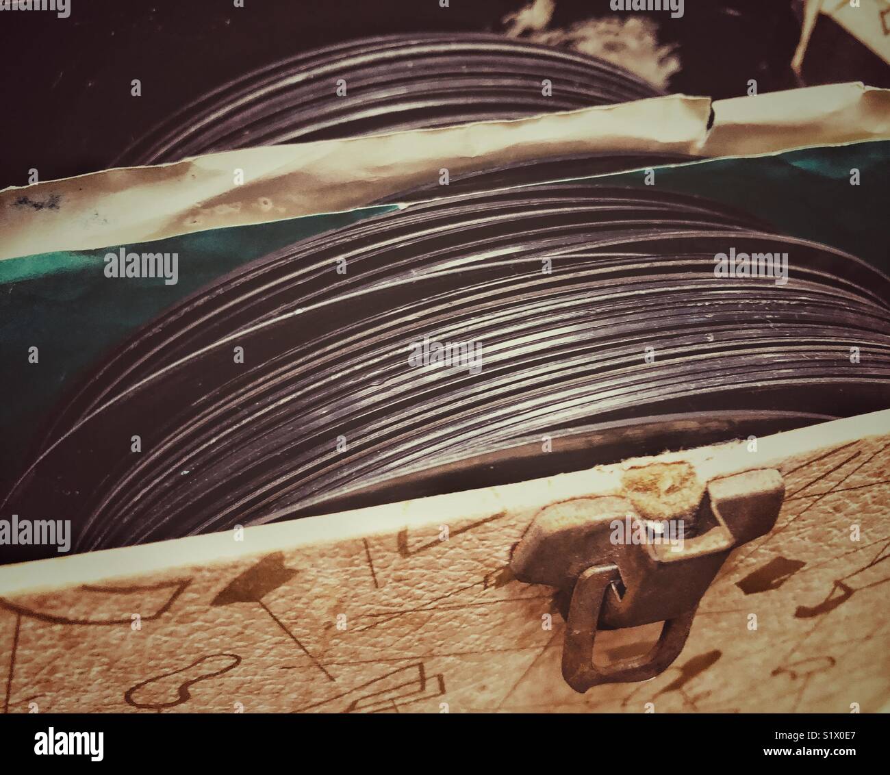 7 inch (45 rpm) vinyl record collection in an old vintage box with latch - Smartphone Captured Stock Image