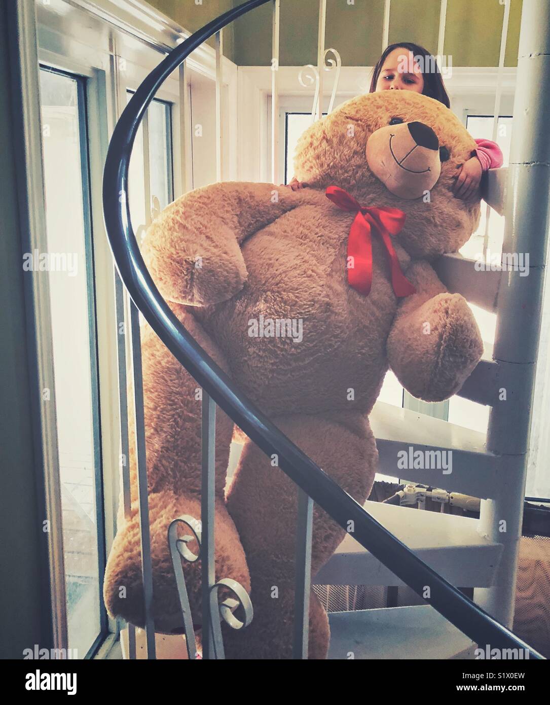 Girl in giant teddy bear outlet