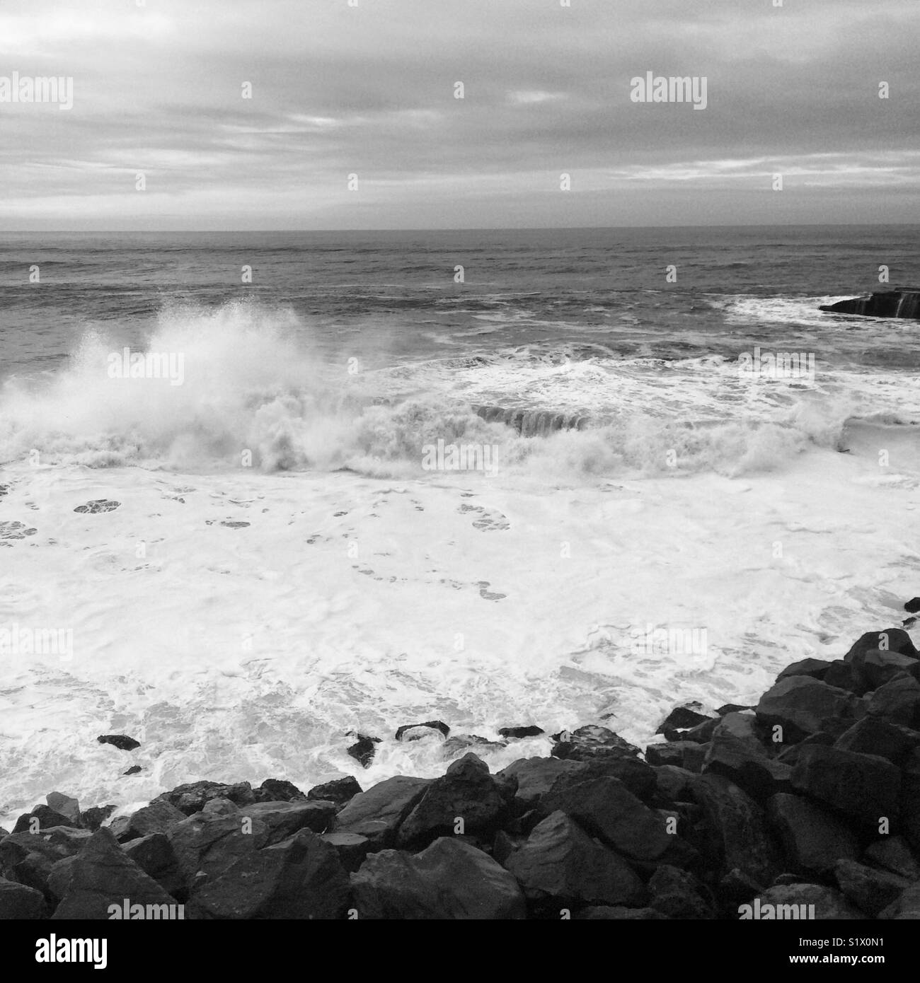 Waves near the rocky shore in Santa Cruz, California - Smartphone Captured Stock Image