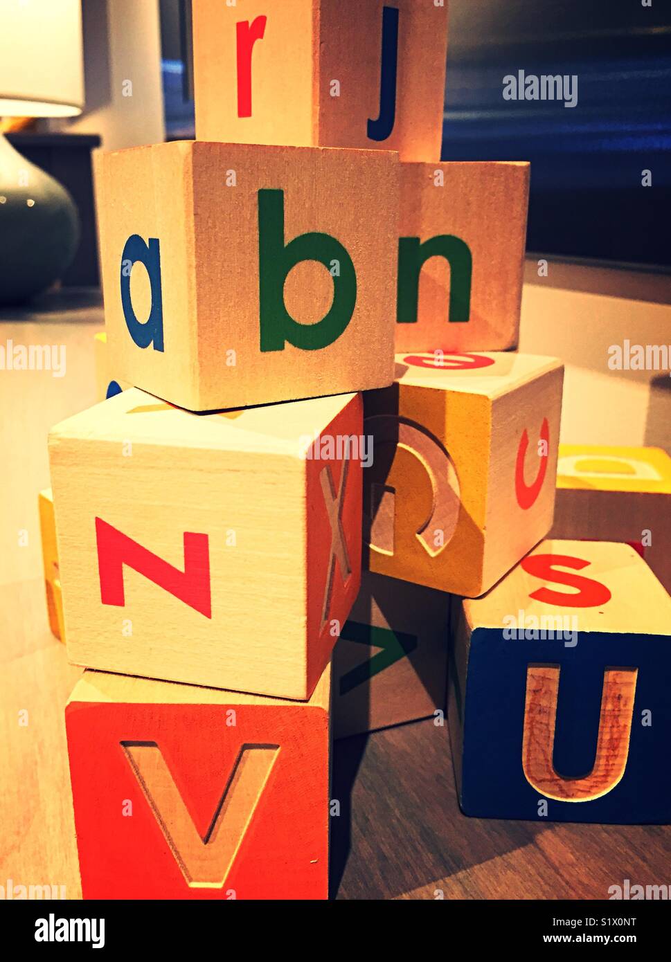 Stack of children’s letter blocks, United States. - Smartphone Captured Stock Image