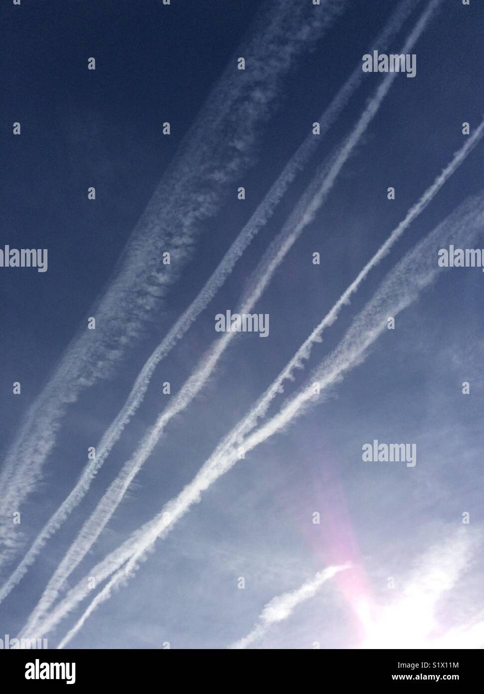 Chemtrails in sky Stock Photo