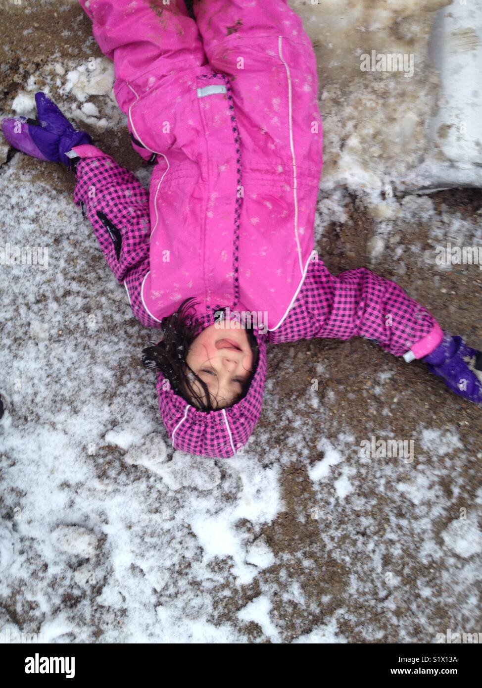Girl enjoying the first Snow. Stock Photo