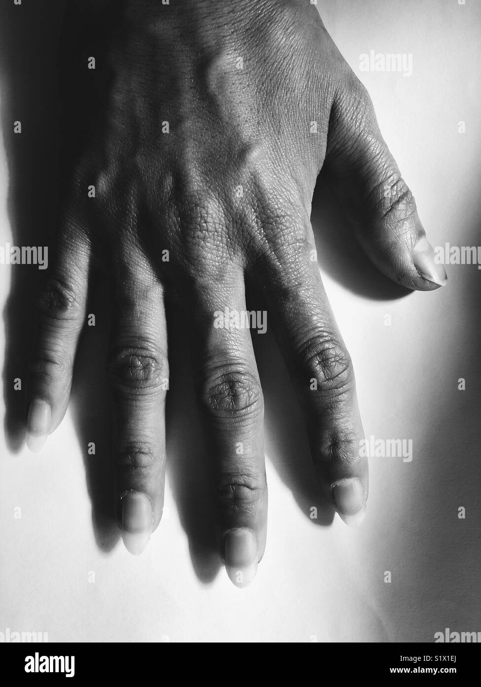 Black and white hand hi-res stock photography and images - Alamy