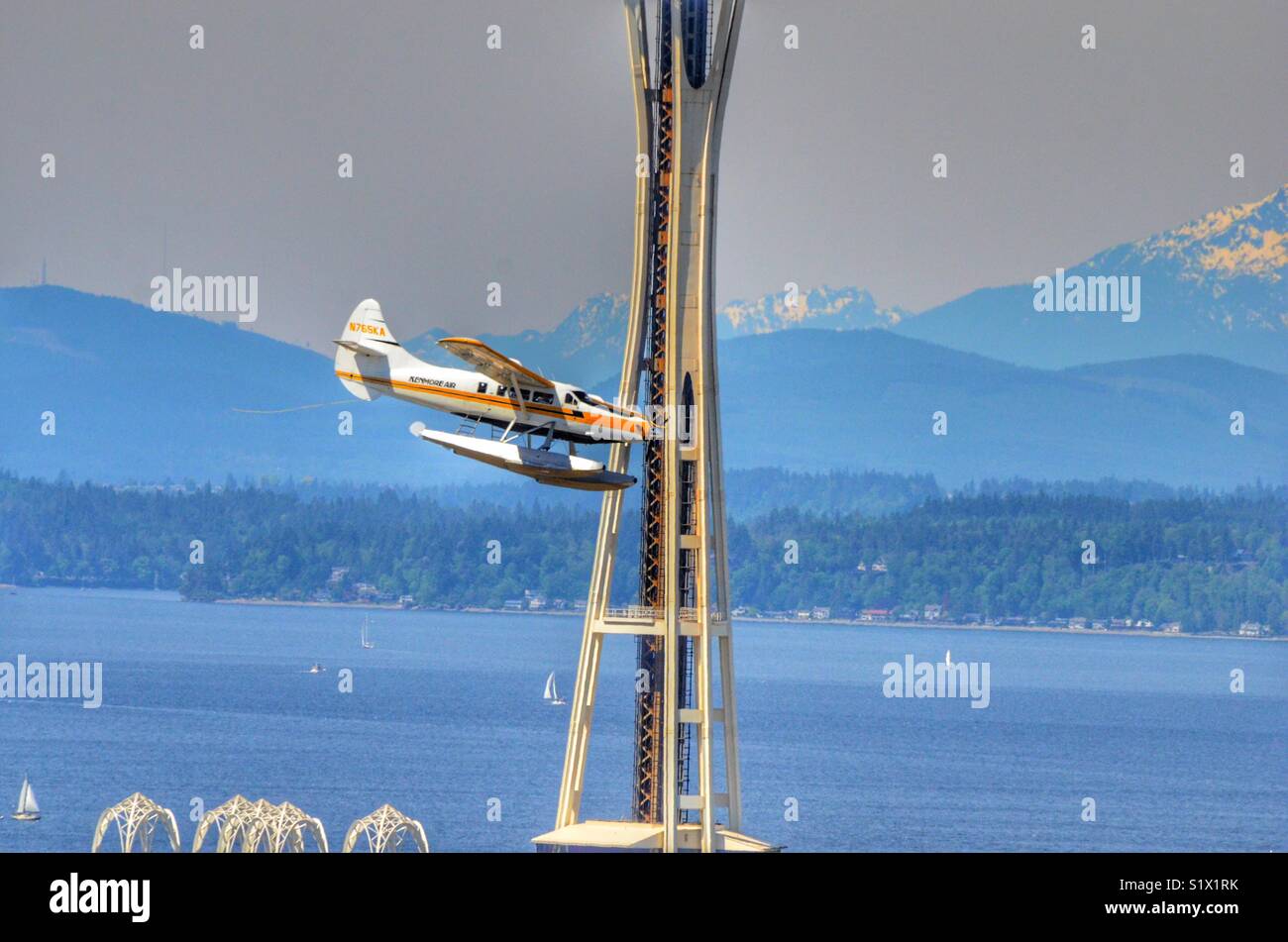 Siri playing on landing approach to Southlake union in Seattle Washington flying right in front of the space needle - Smartphone Captured Stock Image