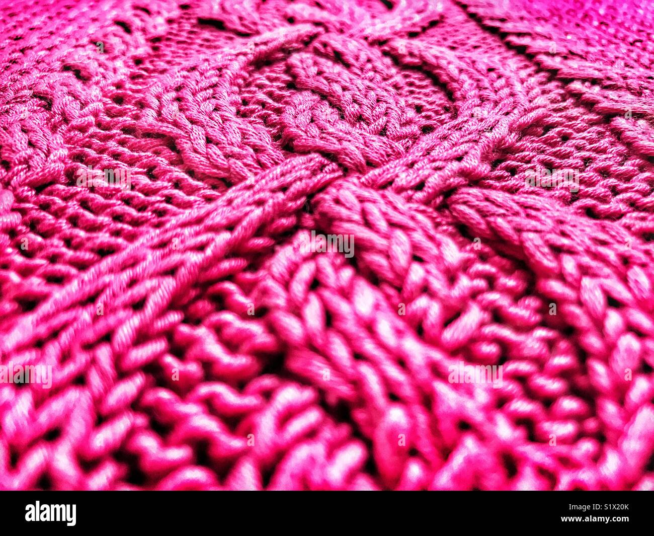 Hand knitted, bright pink, cotton sweater, low angle view - Smartphone Captured Stock Image