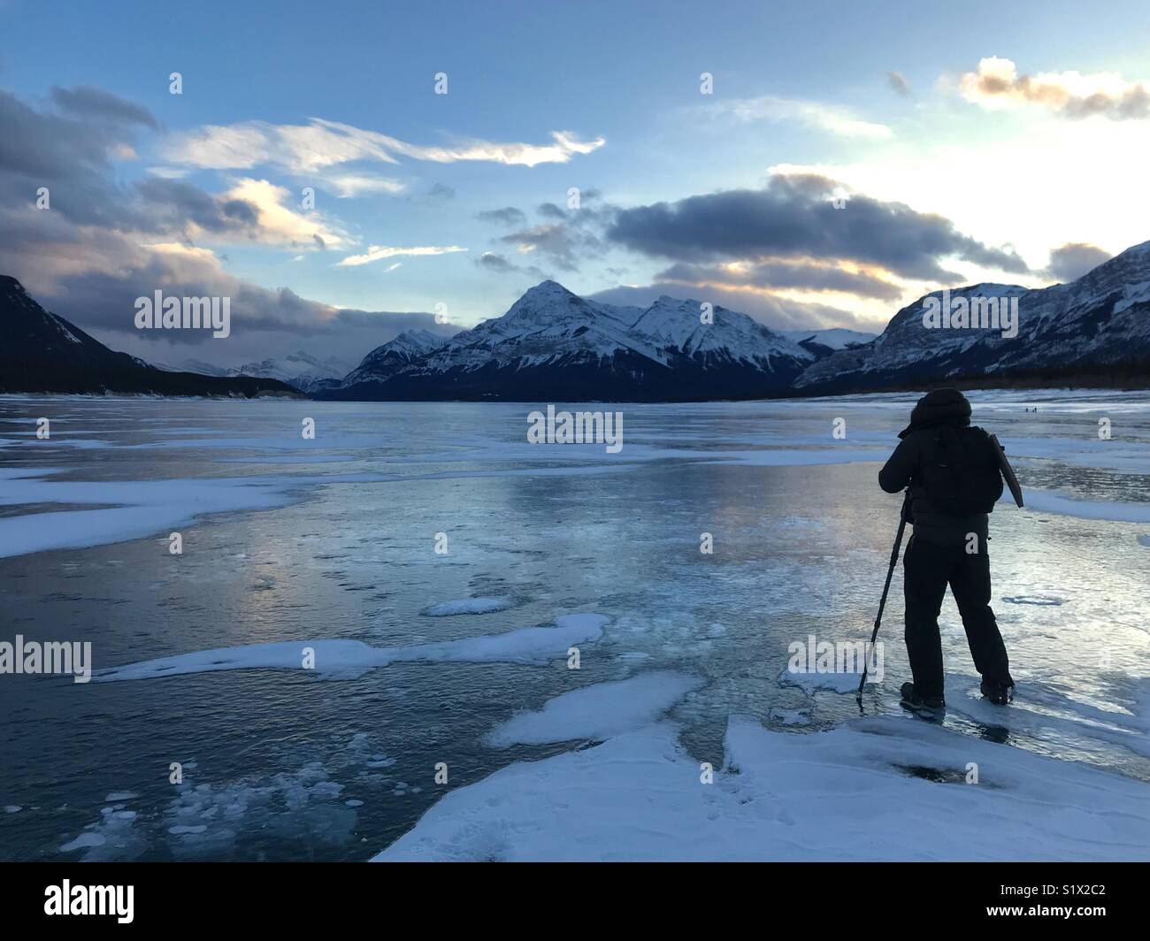 Photographing at sunset, Lake Abraham, winter, Canadian Rockies, Alberta Stock Photo