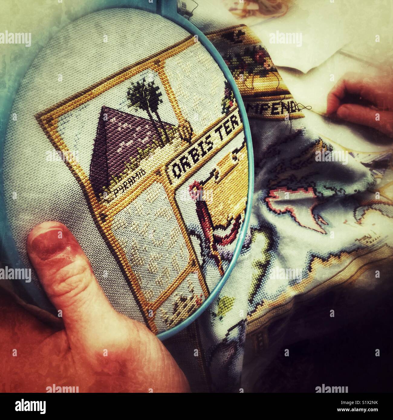 Hands working on embroidery - Smartphone Captured Stock Image