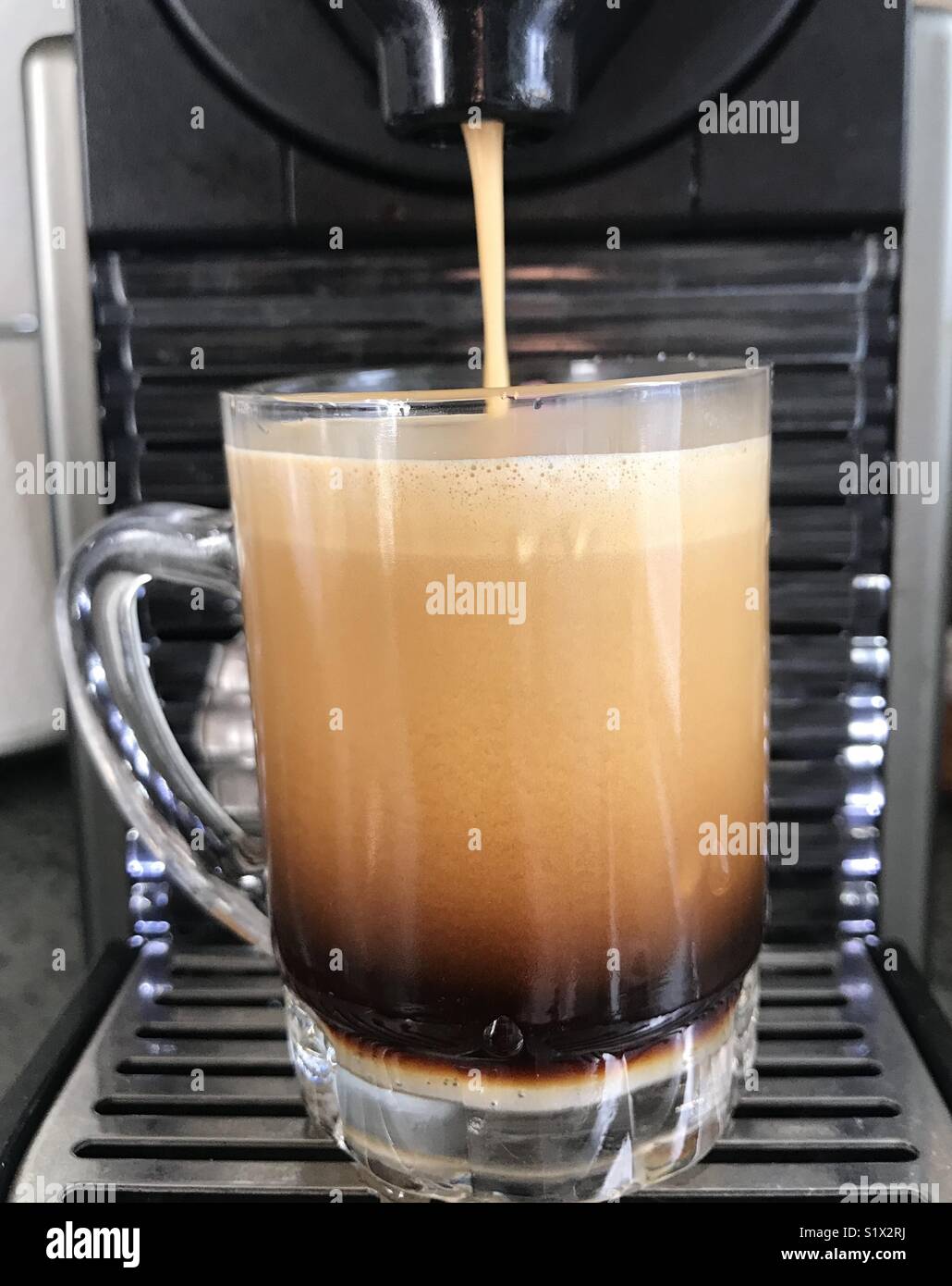Foamy espresso brewing Stock Photo Alamy