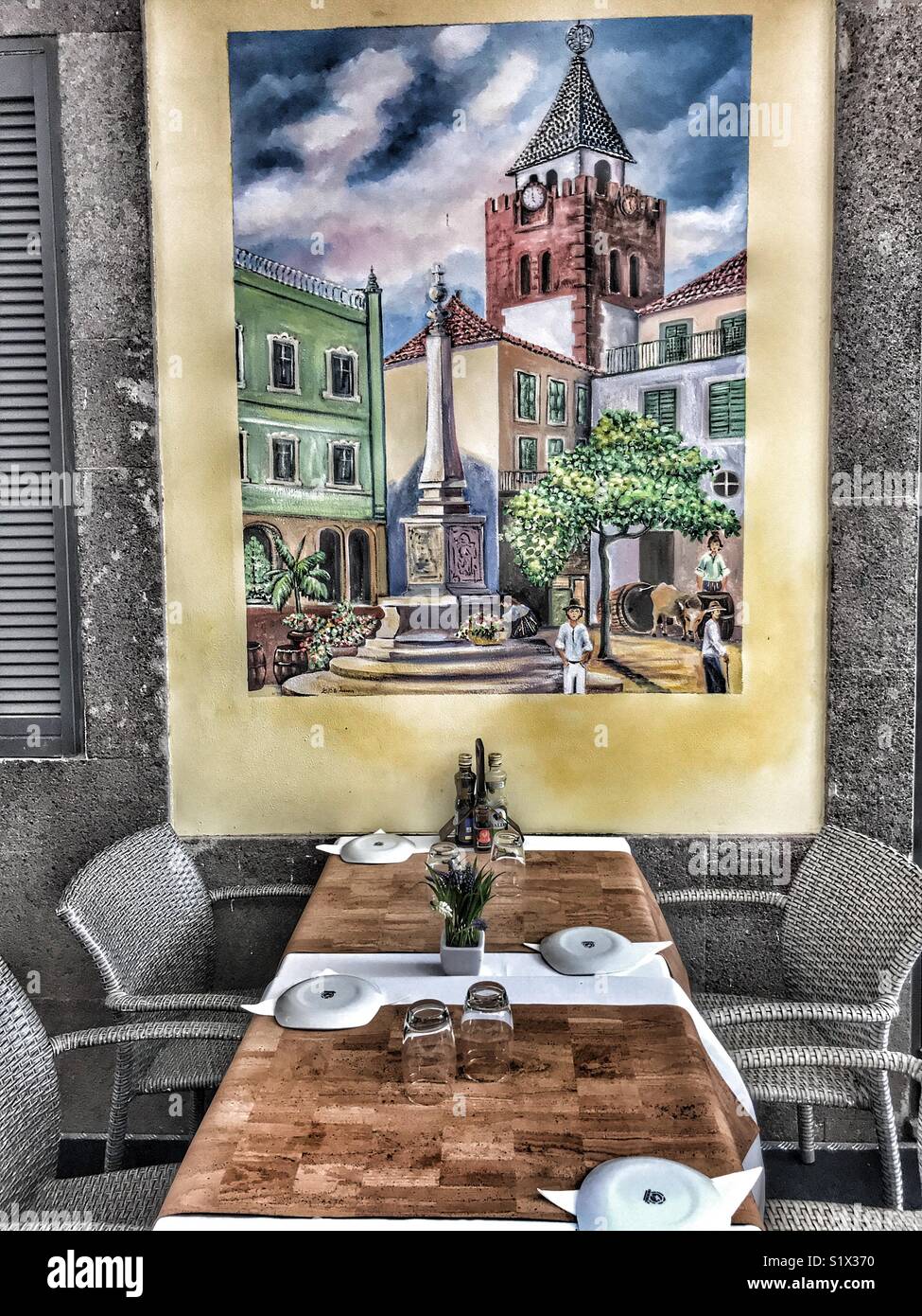 Outdoor table set for lunch at a restaurant in the historic Rua Santa Maria, Saint Maria Street, Funchal, Madeira, Portugal - Smartphone Captured Stock Image